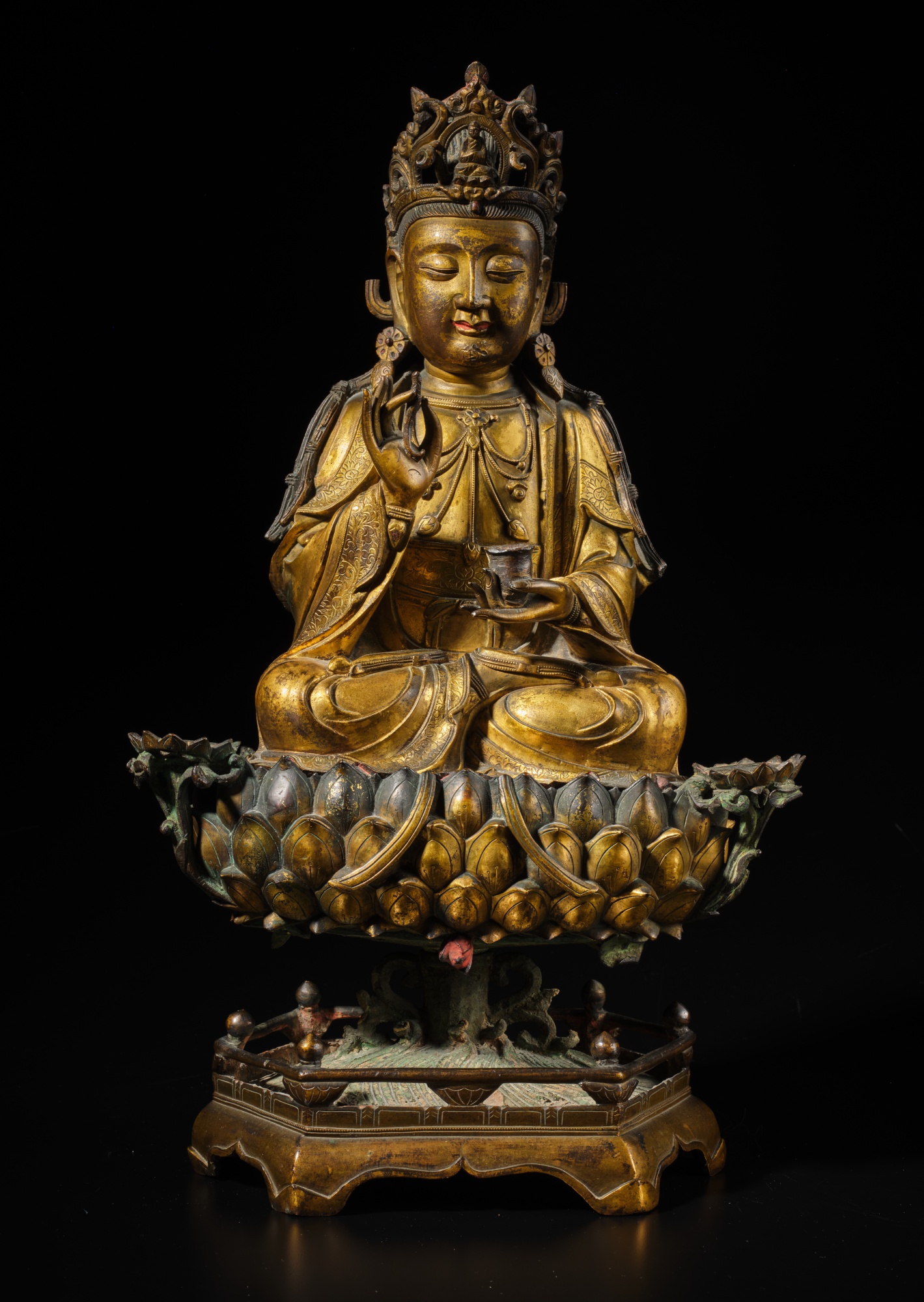 Unknown — A large gilt-bronze figure of Avalokiteshvara and lotus pedestal, late Ming dynasty