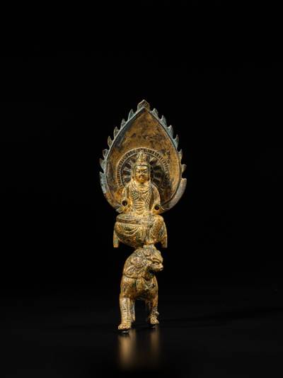 A gilt-bronze figure of Manjushri on a lion, Tang / Song dynasty