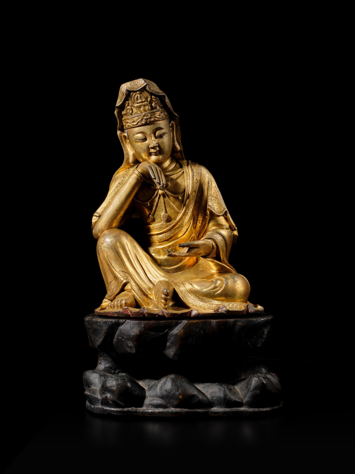 Unknown — A gilt-bronze figure of 'Water-Moon' Avalokiteshvara and bronze stand, Ming dynasty, 16th century