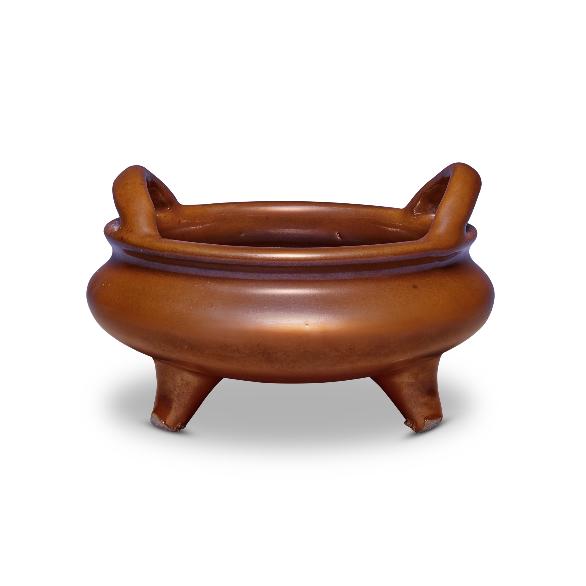 A café-au-lait-glazed bombé-form tripod censer — 清十八世紀 紫金釉橋耳三足爐