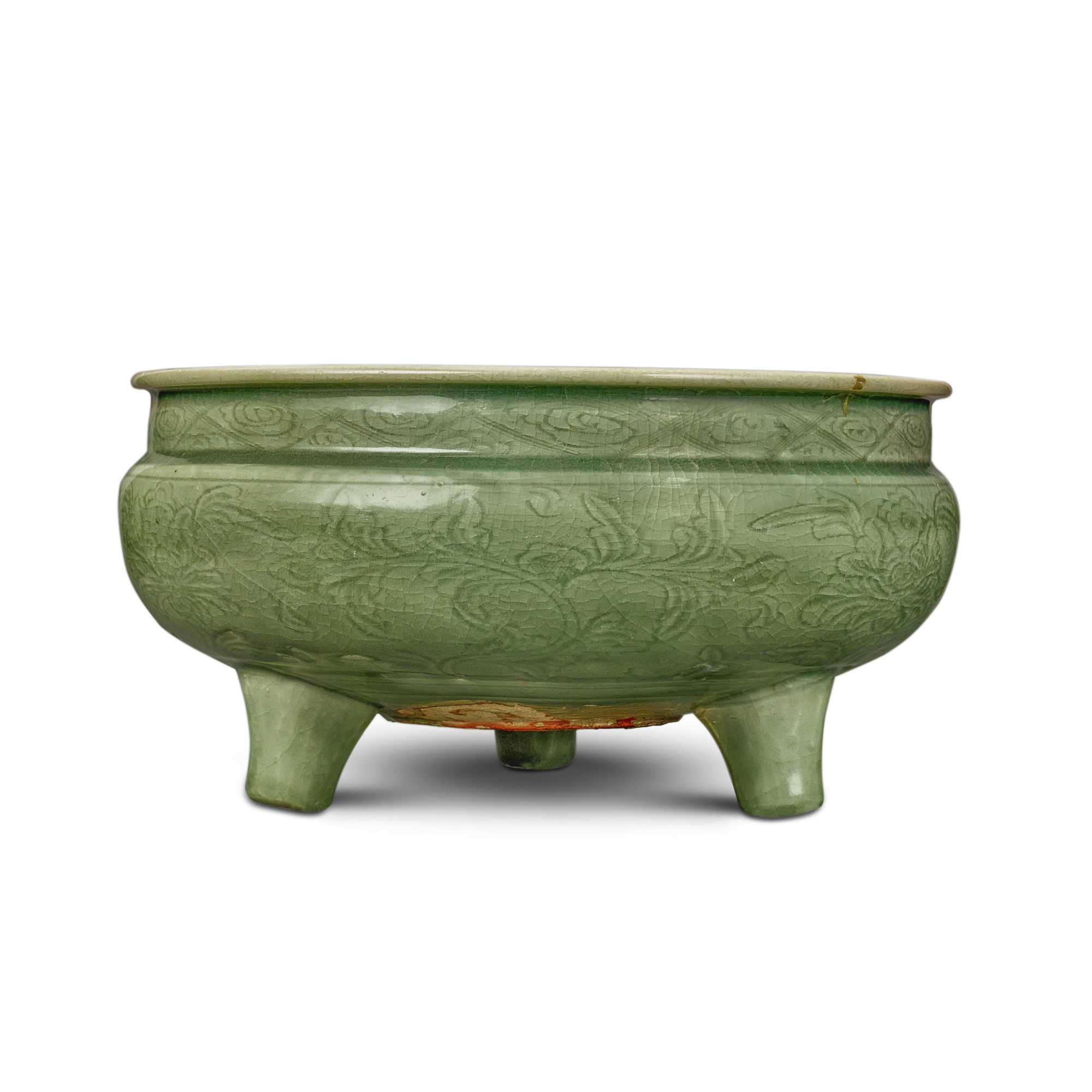 A carved 'Longquan' celadon-glazed tripod censer — 明 龍泉窰青釉刻花卉紋三足爐