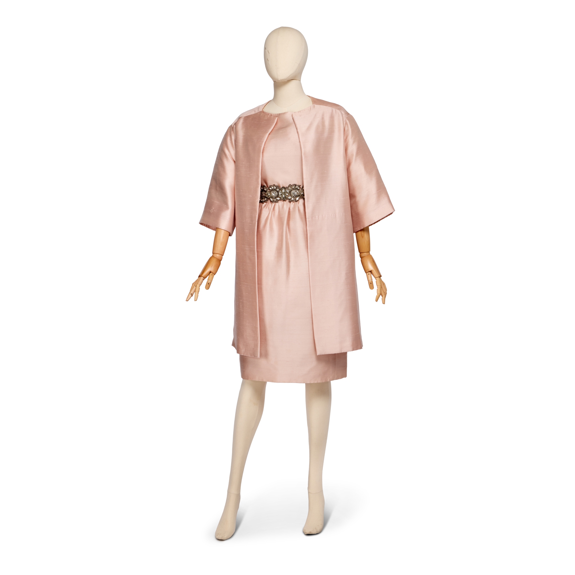 Christian Dior By Marc Bohan Pale Pink Slubbed Silk Cocktail Ensemble, Spring-Summer 1961, comprising dress, matching coat and two belts, one for evening ornately worked by Lesage with cut-brilliants and one for day with bow, London labeled and numbered 30980, bust: 36in, 91cm, waist: 26in, 66cm — Pale Pink Slubbed Silk Cocktail Ensemble, Spring-Summer 1961