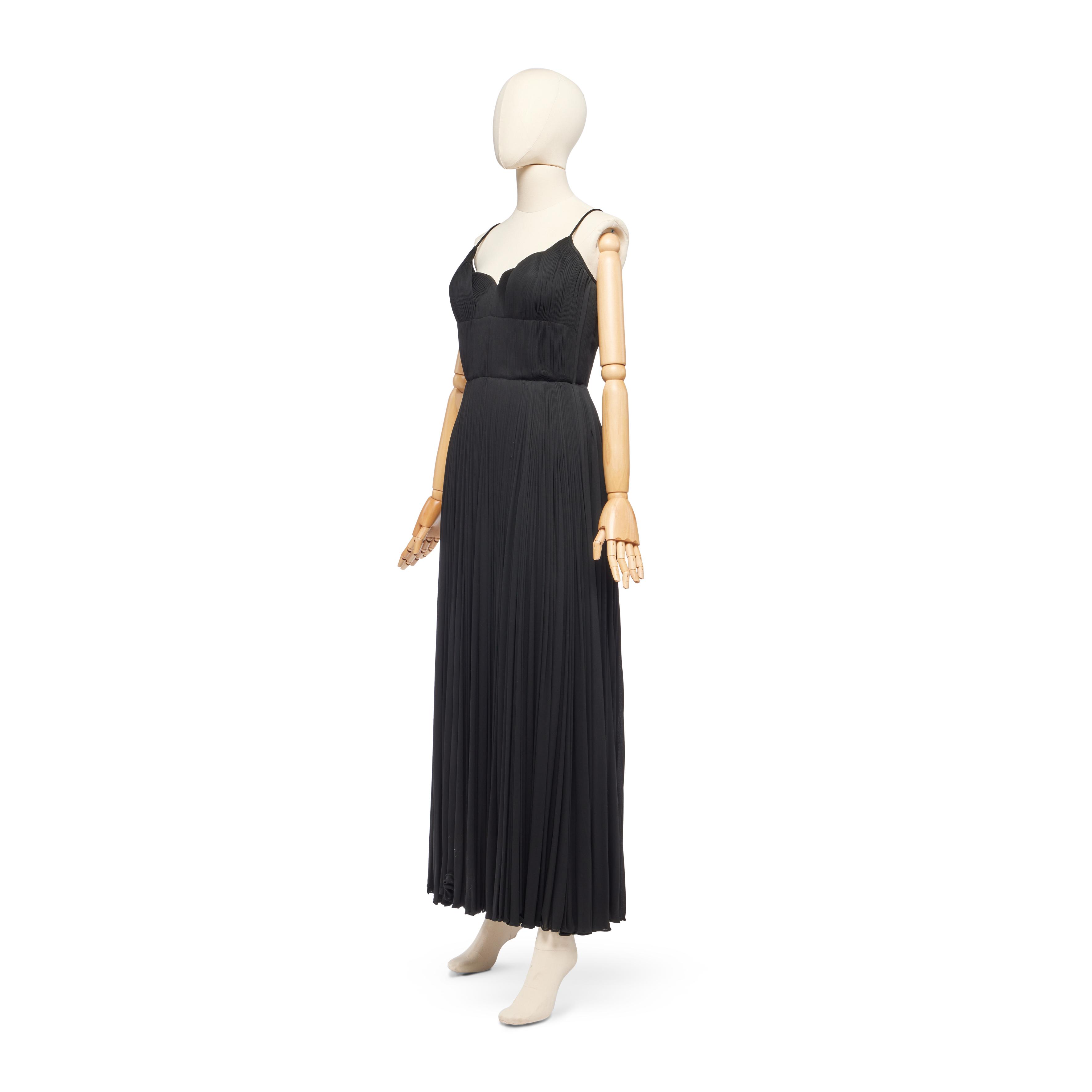 Madame Grès Haute Couture Grecian Black Jersey Evening Gown, circa 1980, with finely pleated and draped scalloped bodice, labeled, bust 36-38in, 92-96cm, waist 28in, 71cm — Haute Couture Grecian Black Jersey Evening Gown, circa 1980 