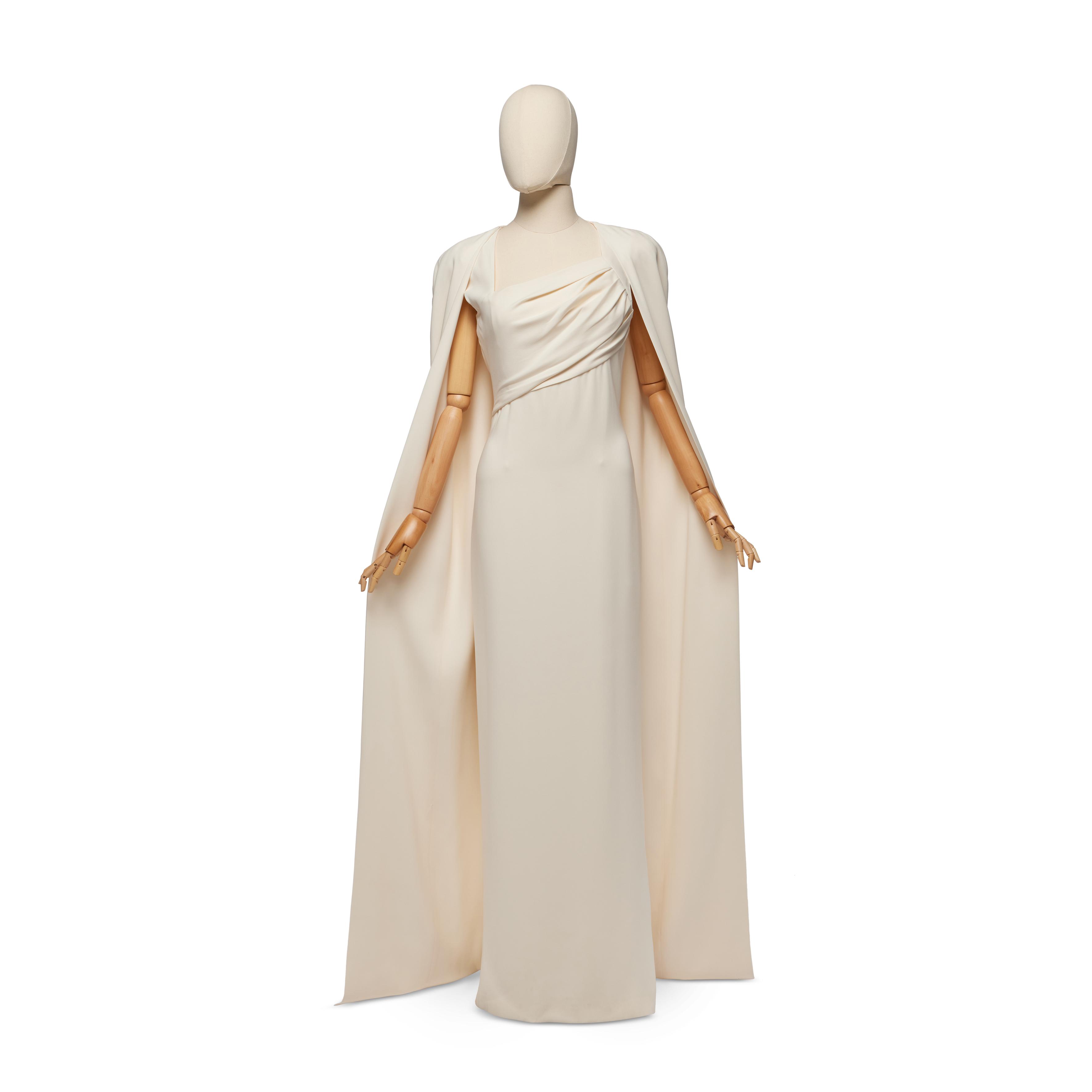 Tom Ford Off -White Crêpe Evening Gown with Matching Cape, Fall - Winter 2012-13, identical to the ensemble worn by Gwyneth Paltrow at the 2012 Academy Awards, labelled, size 42, bust: 34in, 86cm, waist: 28in, 71cm, length (rear neck of dress to hem): 63in, 160cm — Off -White Crêpe Evening Gown with Matching Cape, Fall - Winter 2012-13