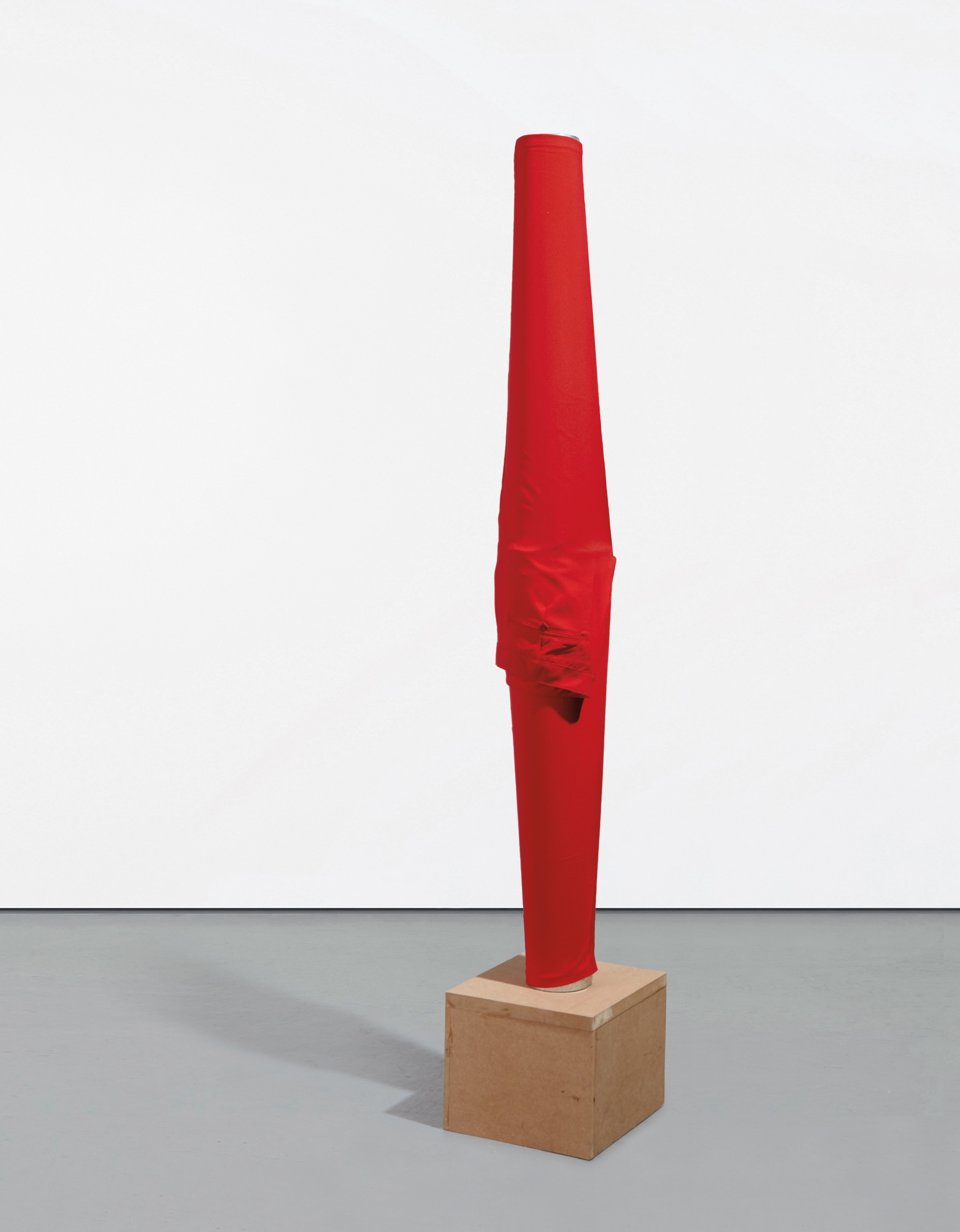 Erwin Wurm — red cotton pants on zinc tube on MDF base