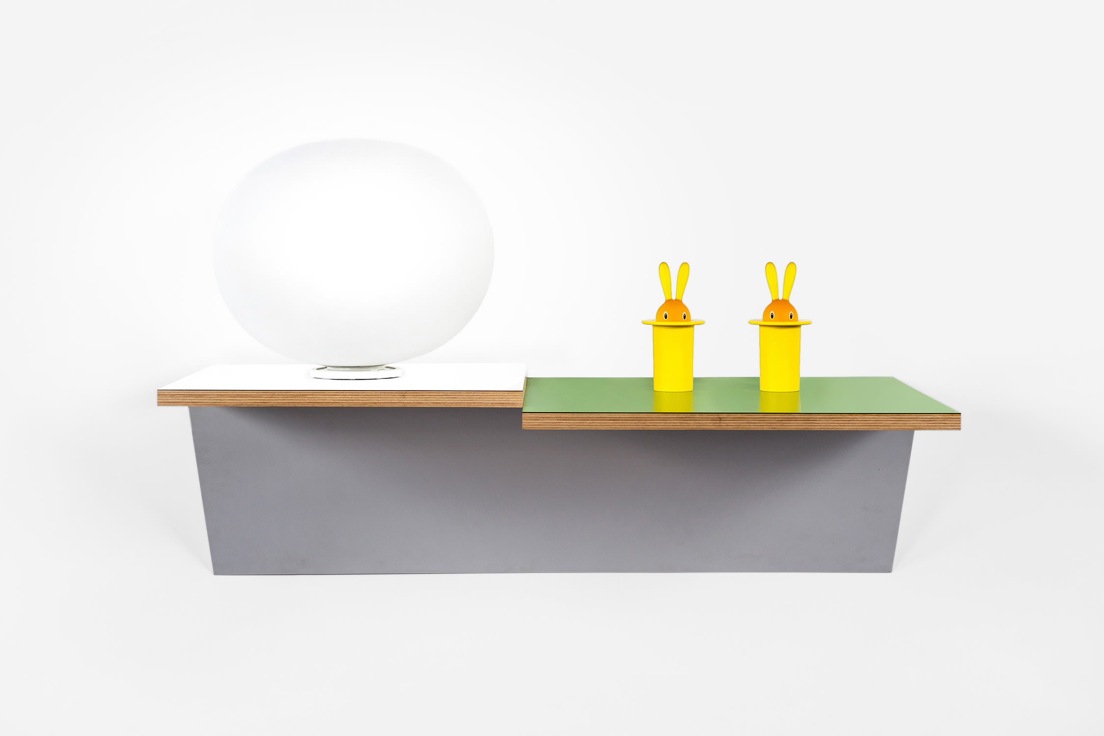Haim Steinbach — plastic laminated wood shelf, 2 Magic Bunny toothpick holders and glass lamp