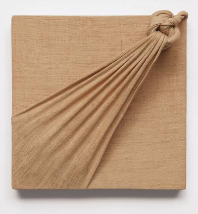 knotted burlap mounted on wood