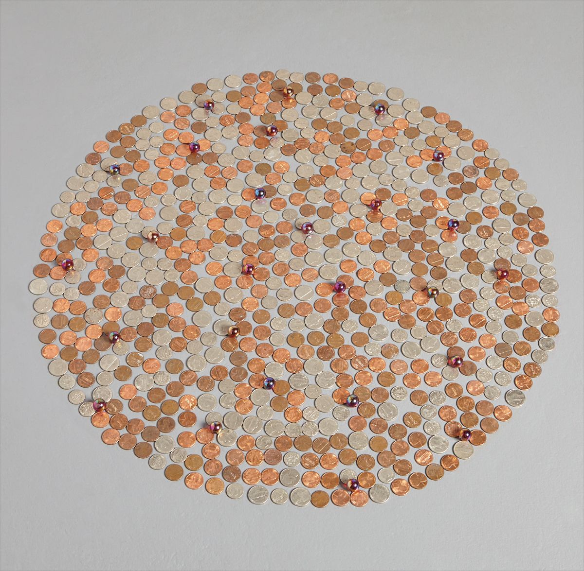 Tony Feher — pennies, nickels, dimes and iridescent ruby red marbles