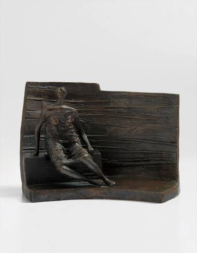 Draped Seated Figure against Curved Wall