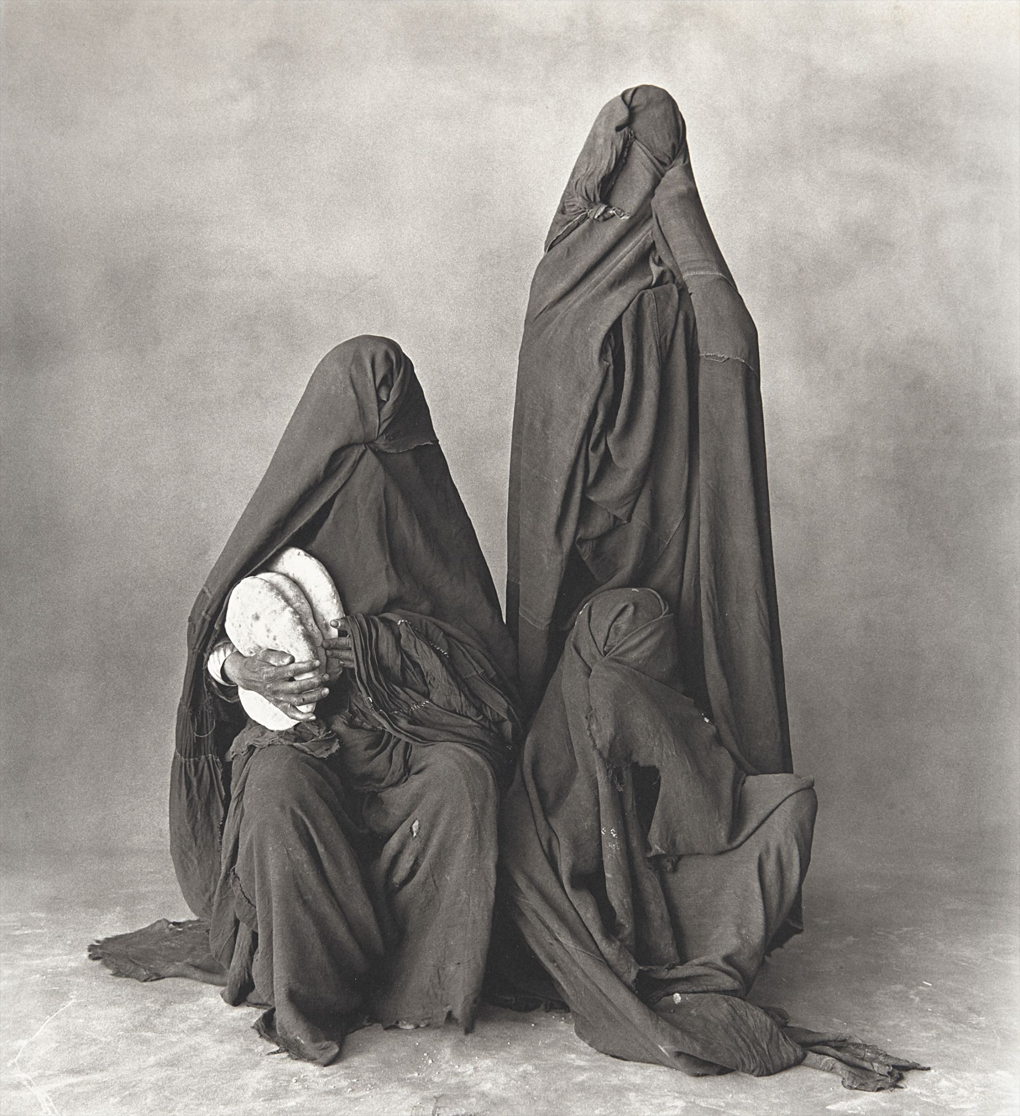 Irving Penn — Three Rissani Women with Bread