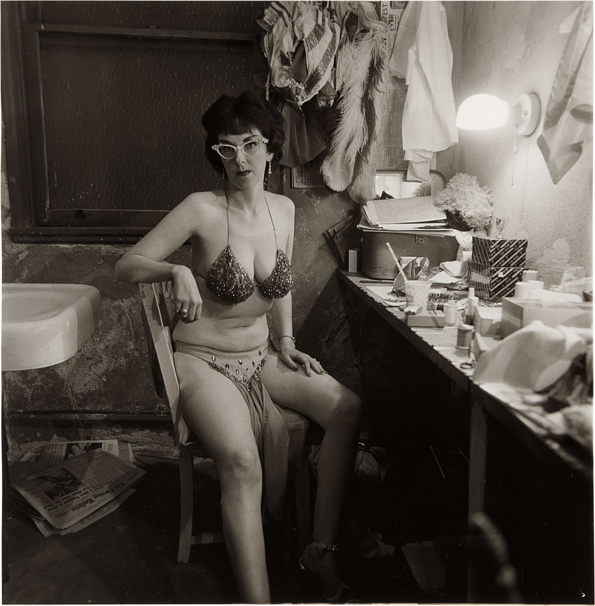 Diane Arbus — Stripper, Miss Sata Lyte, in her dressing room with glasses Atlantic City, N.J.