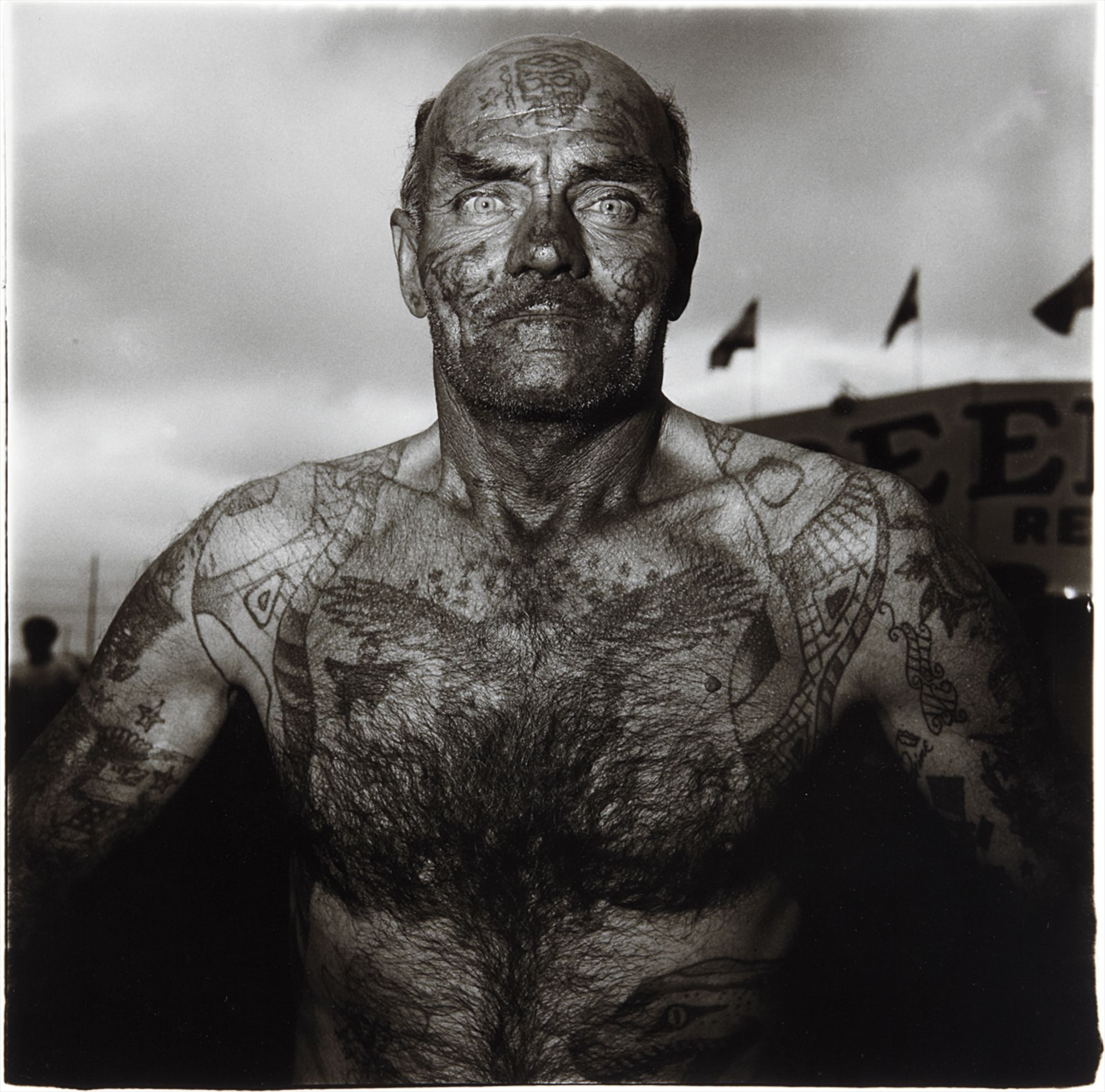 Diane Arbus — Tattooed man at a Carnival, M.D.