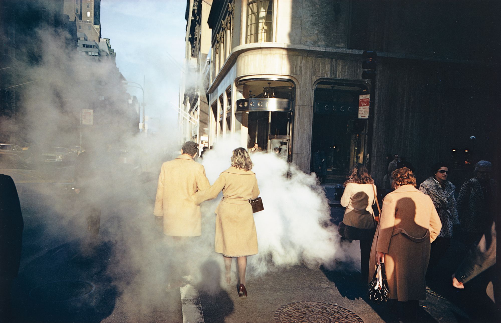 Camel coat couple in street steam, New York City