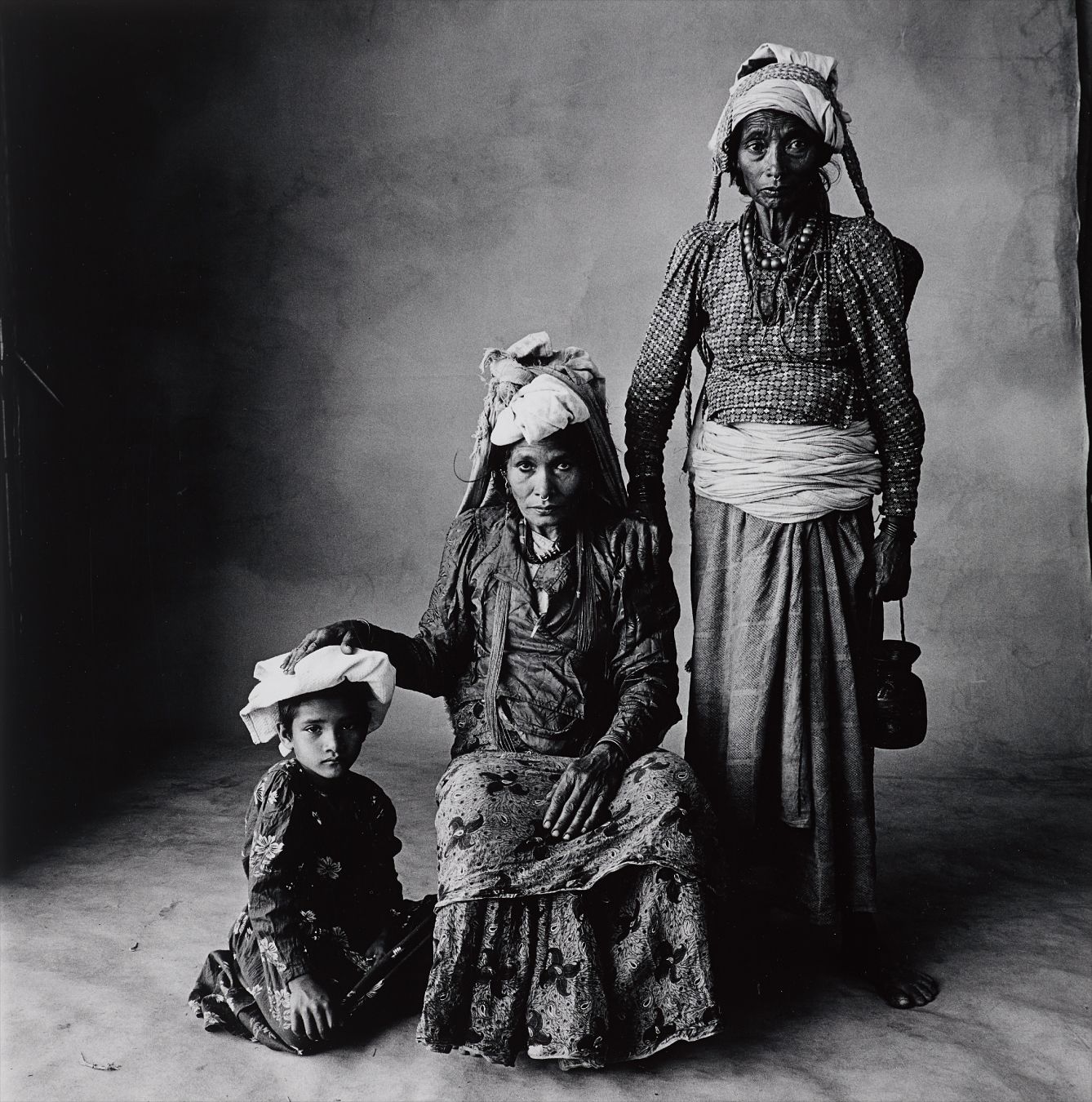 Irving Penn — Standing Woman, Sitting Woman, and Child (Nepal)