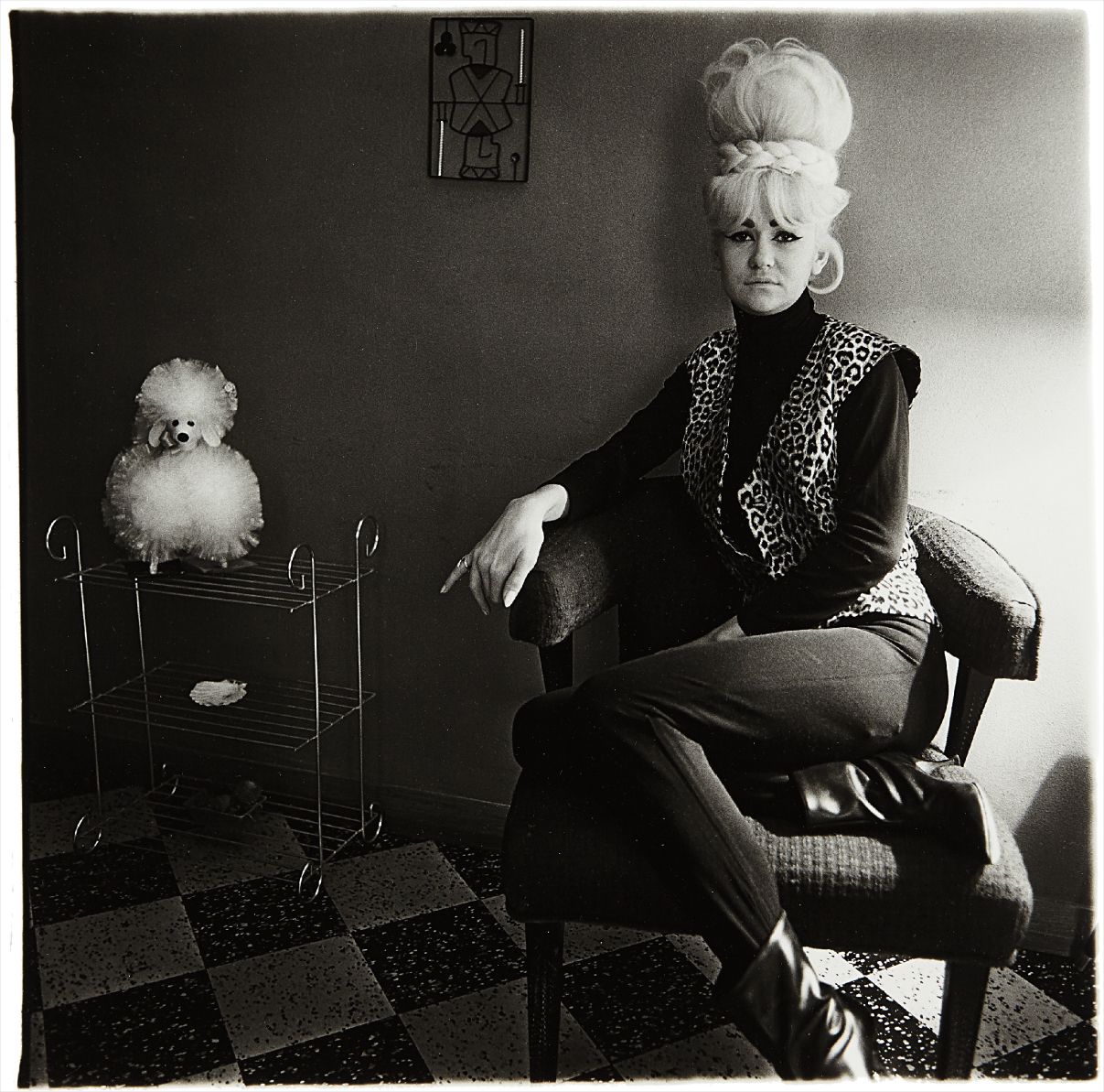 Diane Arbus — Lady bartender at home with souvenir dog, New Orleans