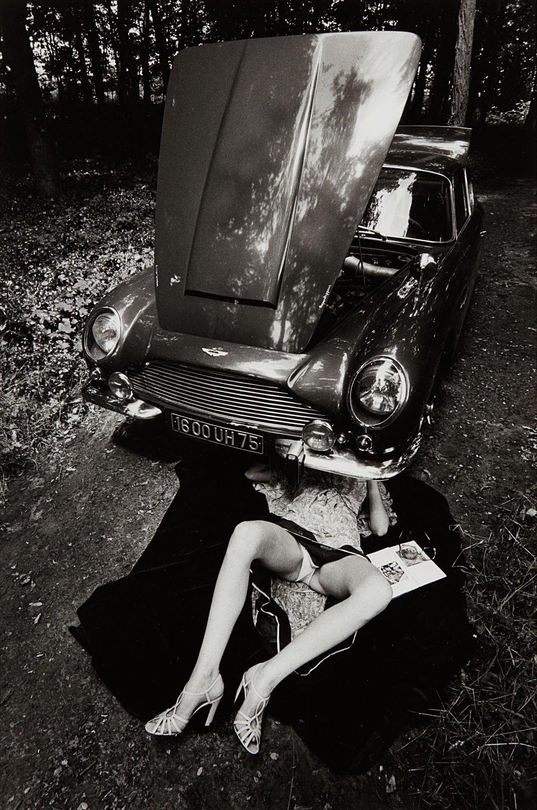 Alone Under a Car with Open Hood, Paris