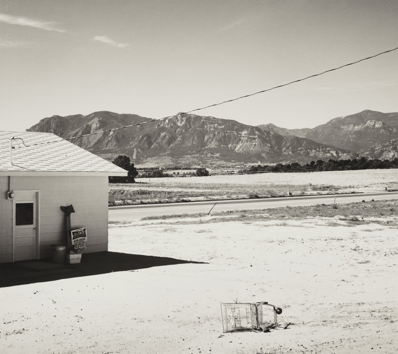 Robert Adams — Tract home and abandoned shopping cart. Colorado Springs, Colorado