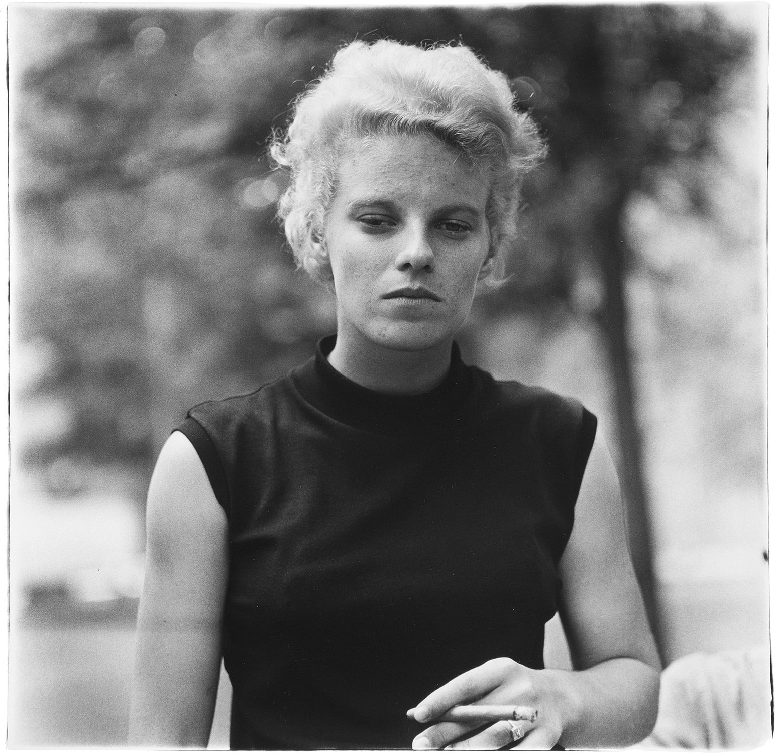 Diane Arbus — Girl with a cigar in Washington Square Park, N.Y.C.