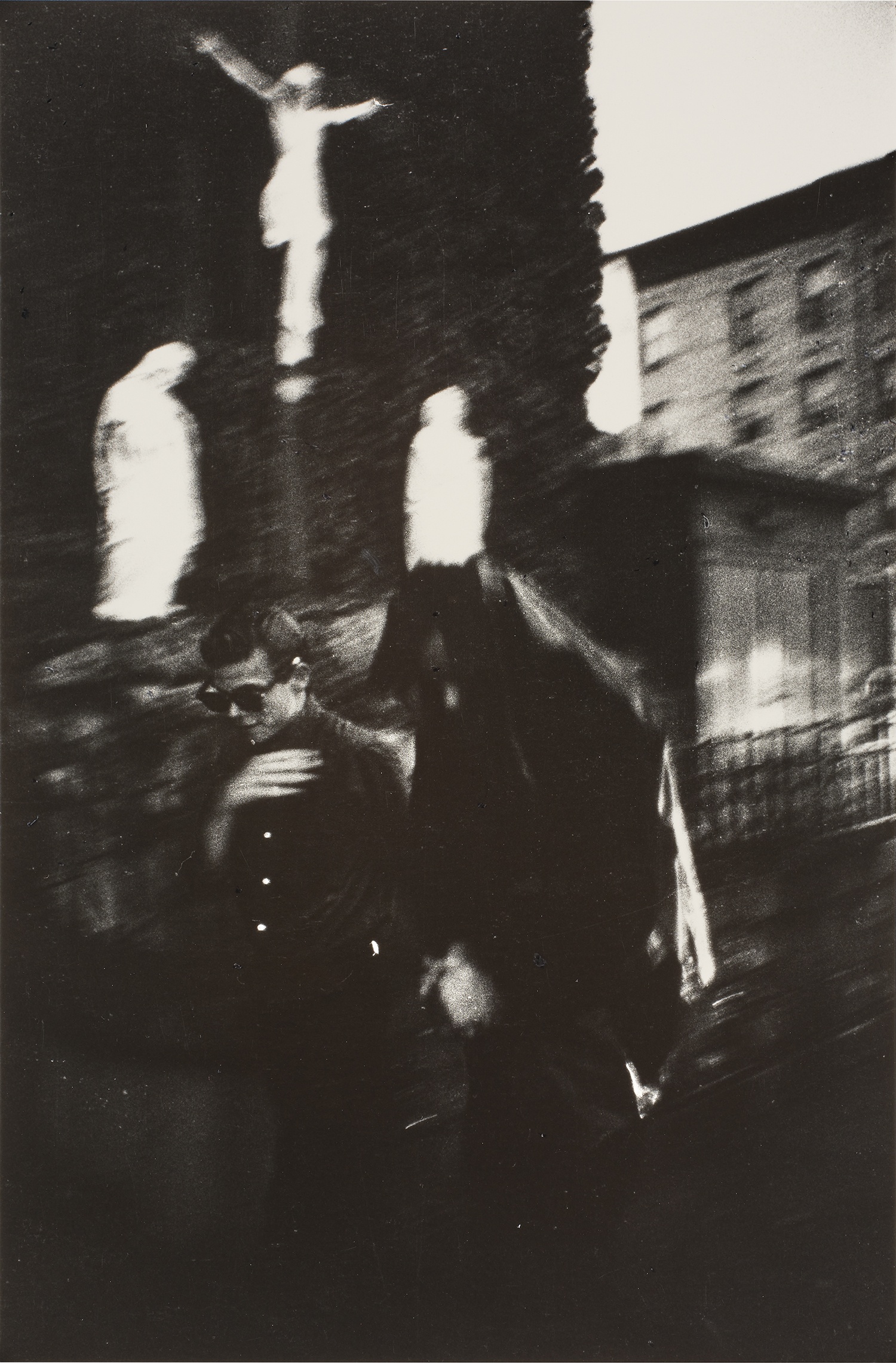 Bruce Davidson — Brooklyn Gang (Bengie crossing himself in front of Holy Name Church)
