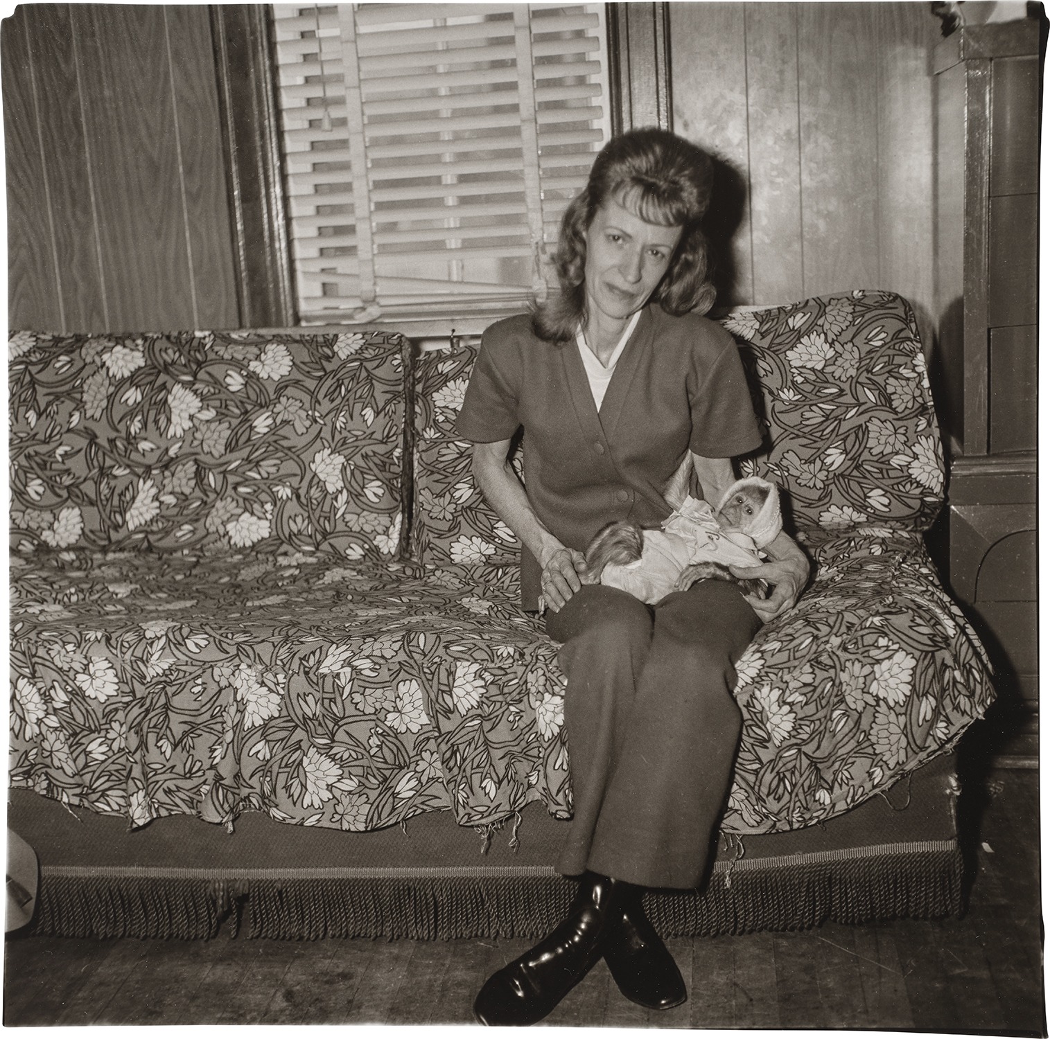 Diane Arbus — A Woman with Her Baby Monkey, N.J.