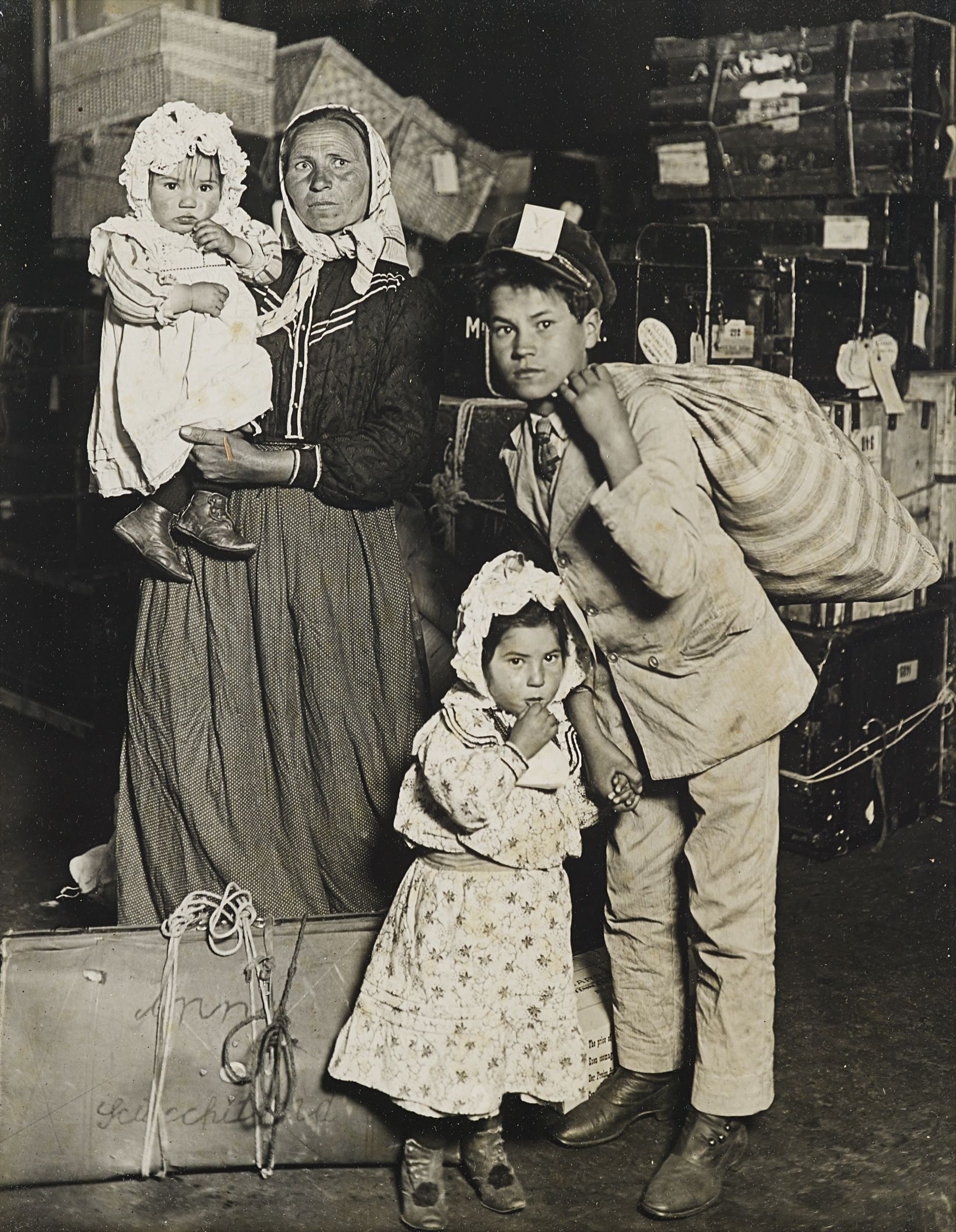 Lewis Hine — Italian Family Looking for Lost Baggage, Ellis Island, New York