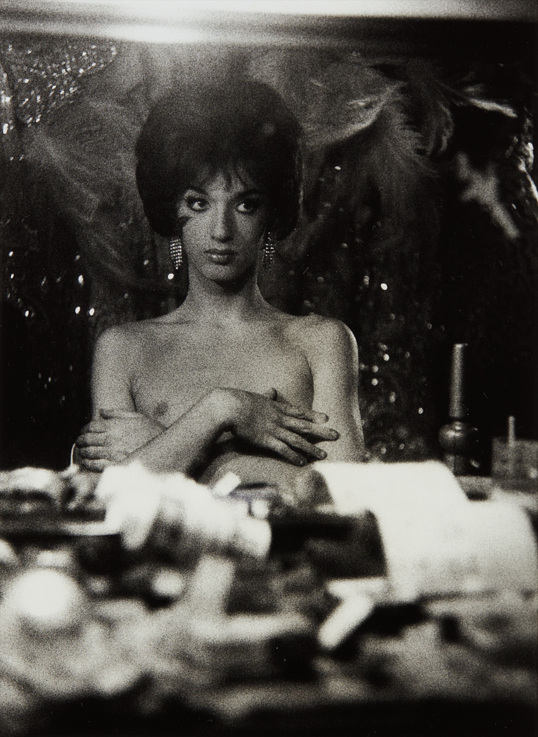 Diane Arbus — Seated female impersonator with arms crossed on her bare chest, N.Y.C.