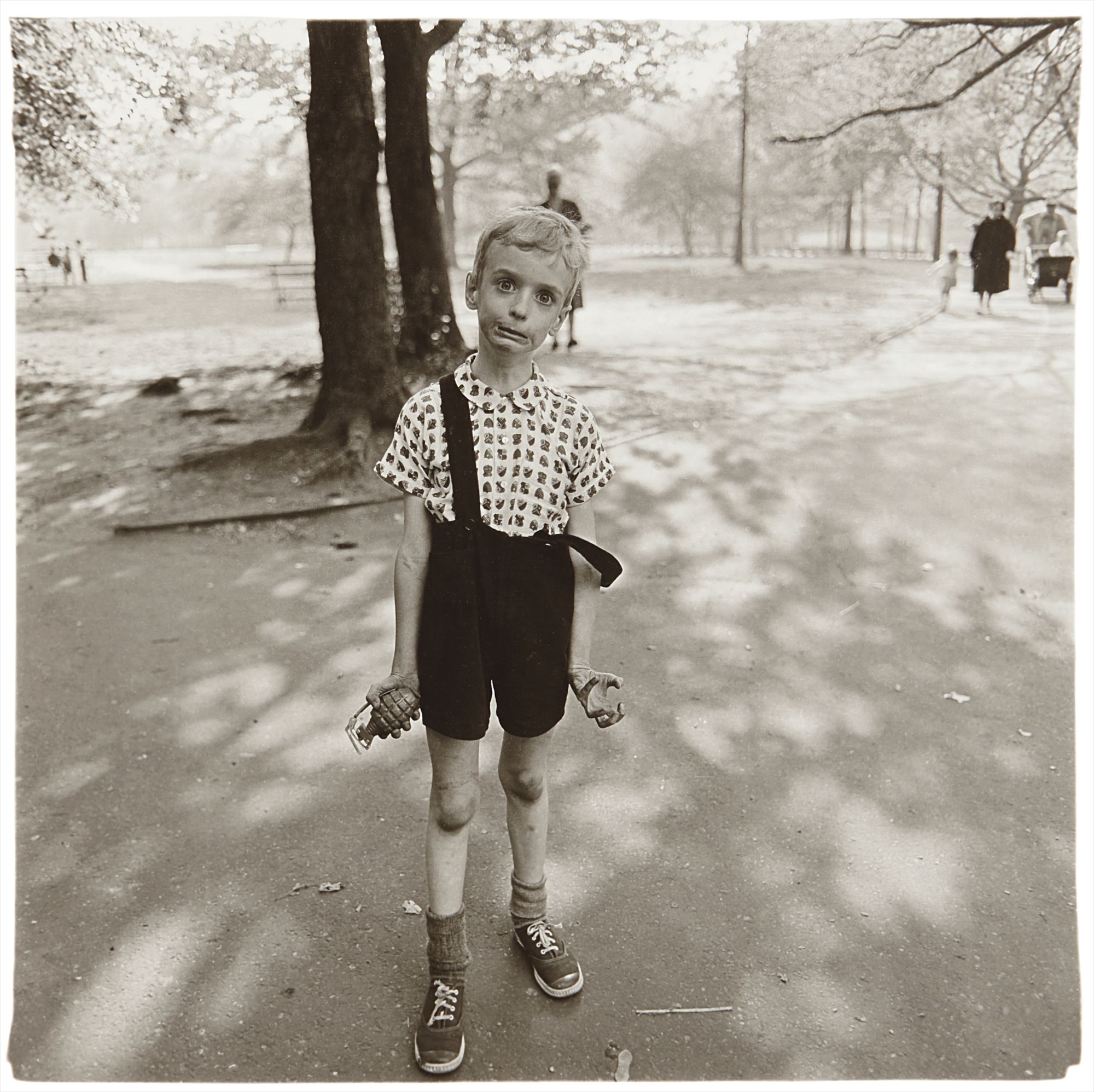 Diane Arbus — Child with a toy hand grenade in Central Park, N.Y.C., 1962