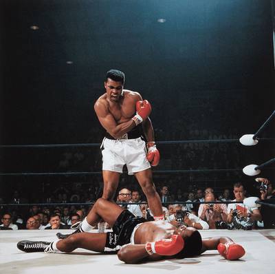 Muhammad Ali reacts after his first round knockout of Sonny Liston during the 1965 World Heavyweight Title fight at St. Dominic’s Arena, Lewiston, Maine