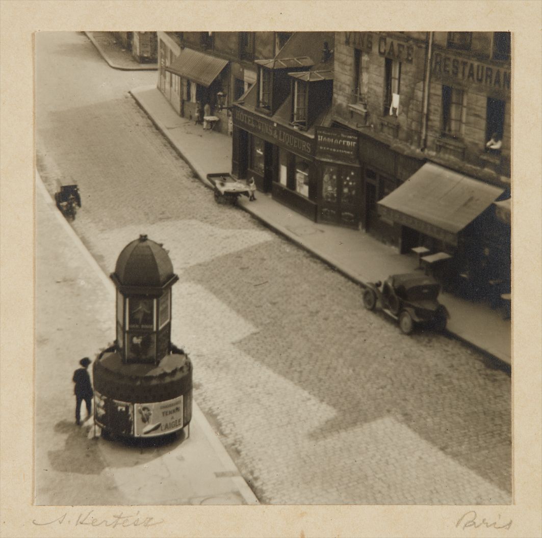 André Kertész — Paris (man at a pissoir, Latin Quarter)