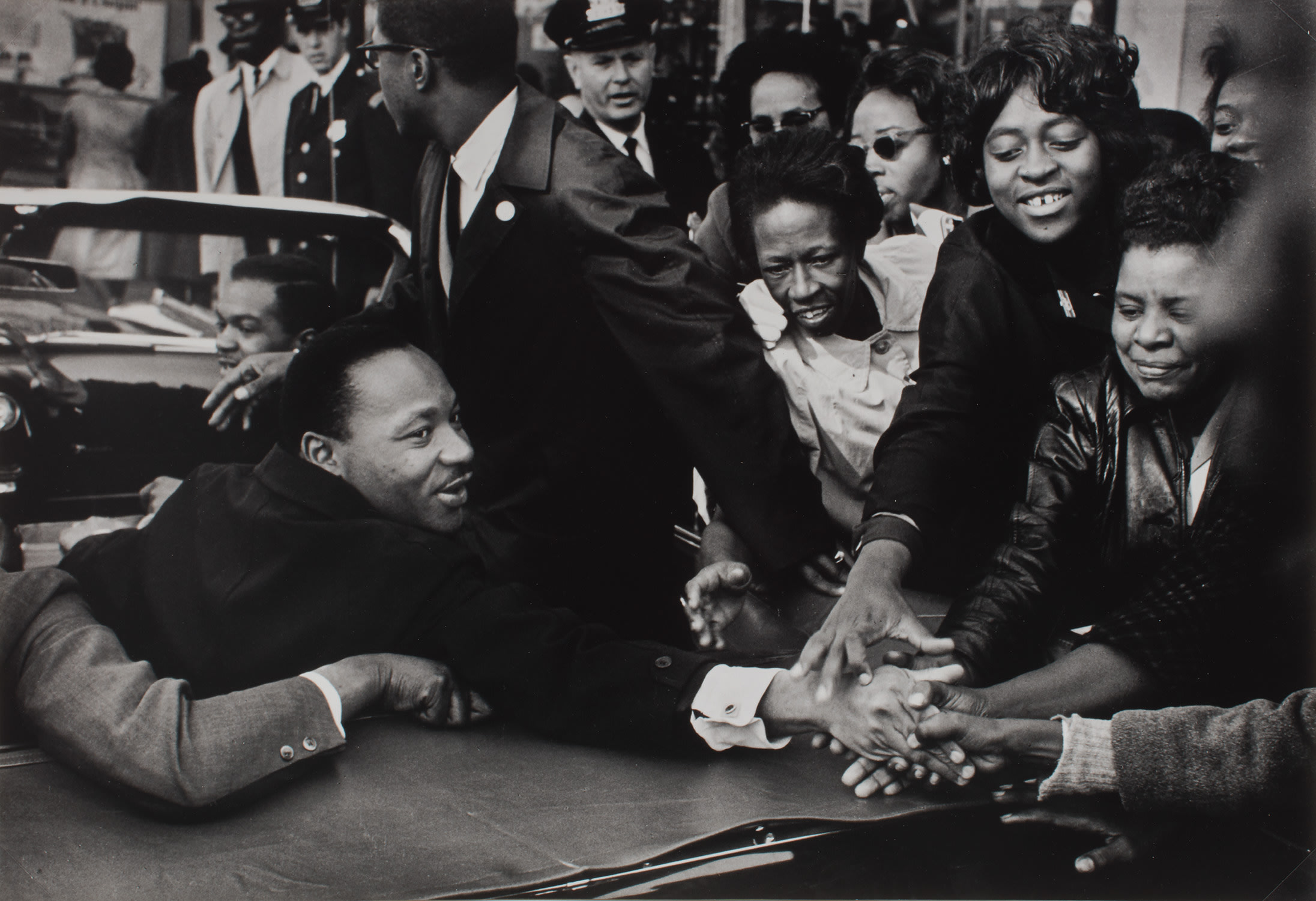 Leonard Freed — The Reverend Martin Luther King Jr. being greeted in an open car, Maryland