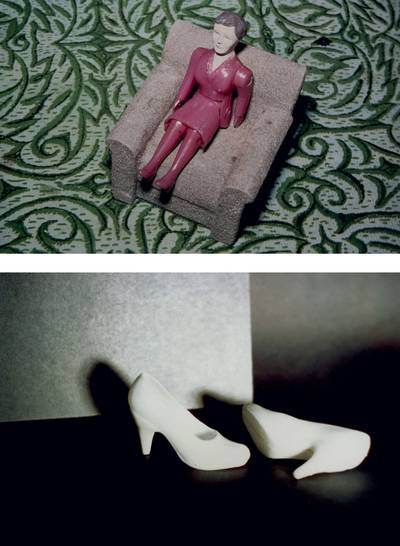 Woman/Gray Chair/Green Rug; White Shoes/Black Room