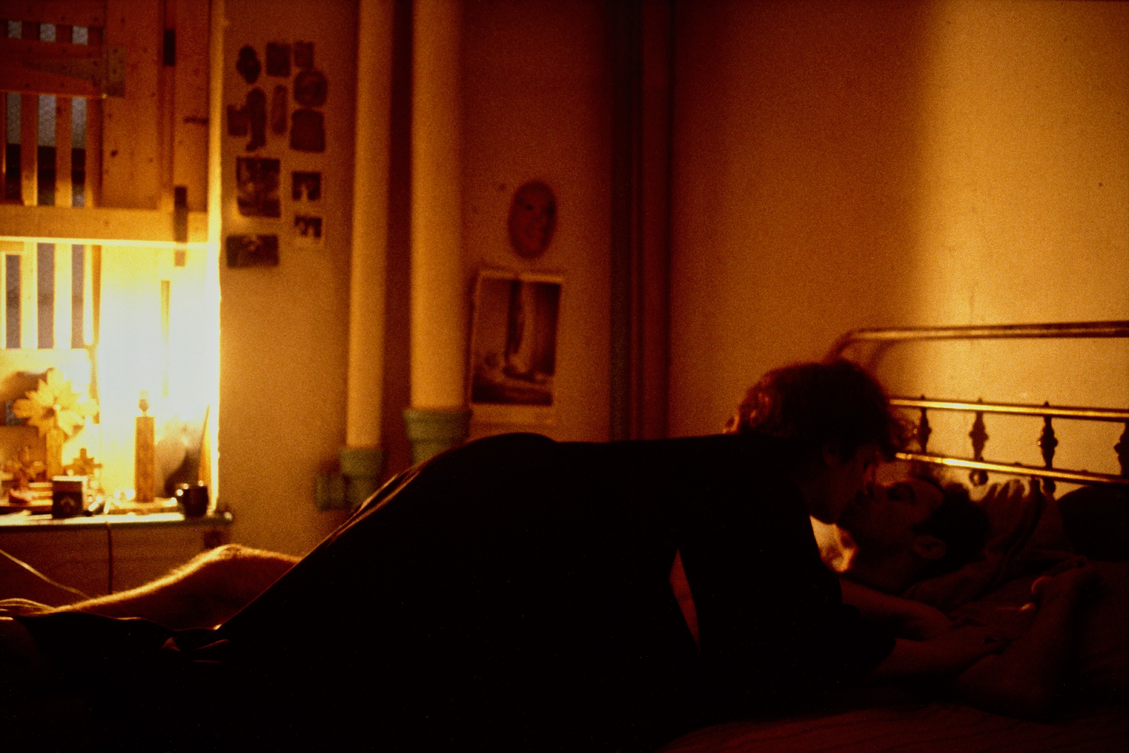 Nan Goldin — Self-portrait on top of Brian; Kissing, NYC