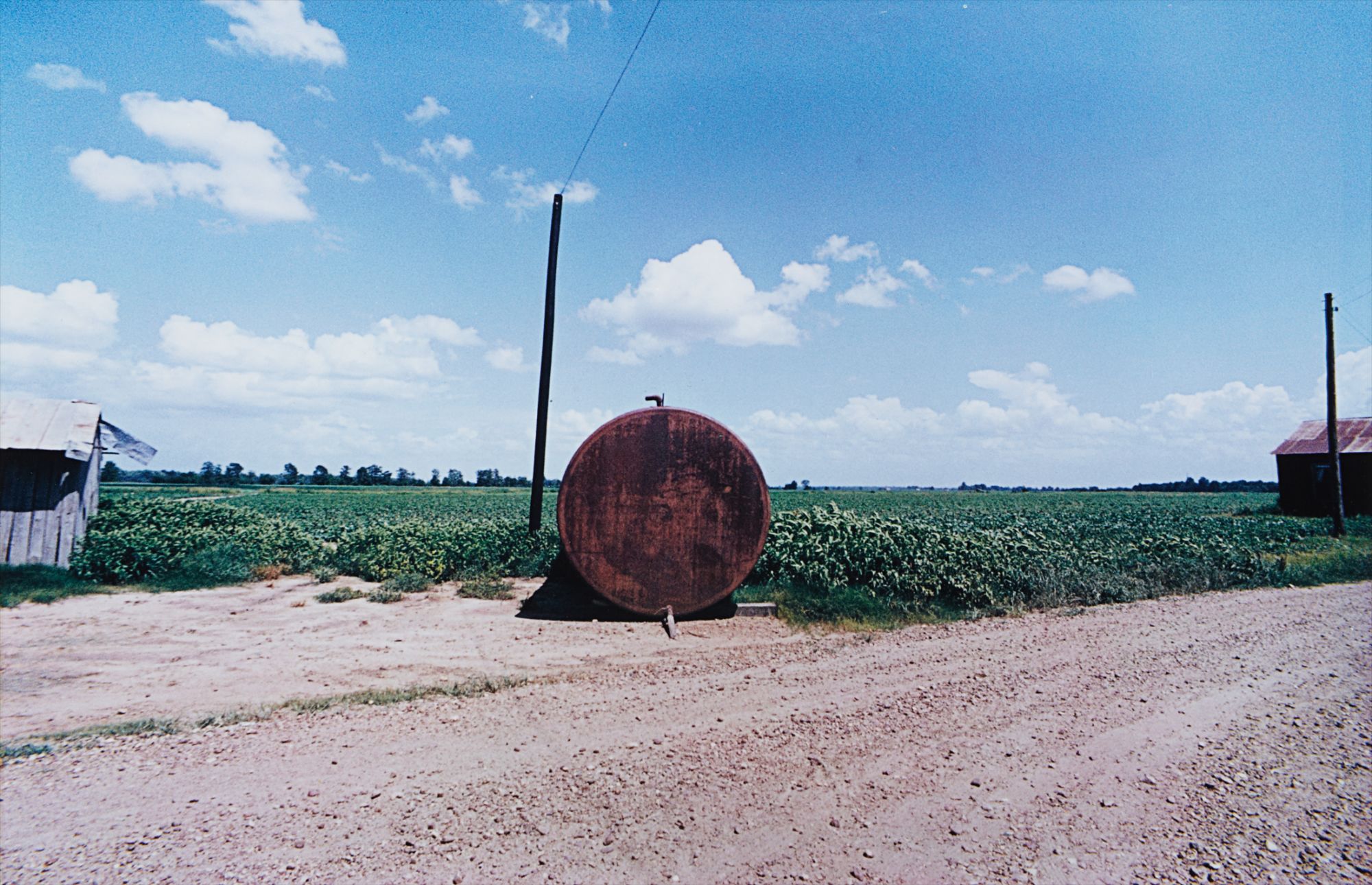 William Eggleston — Black Bayou Plantation near Glendora, Mississippi (Red Barrel)
