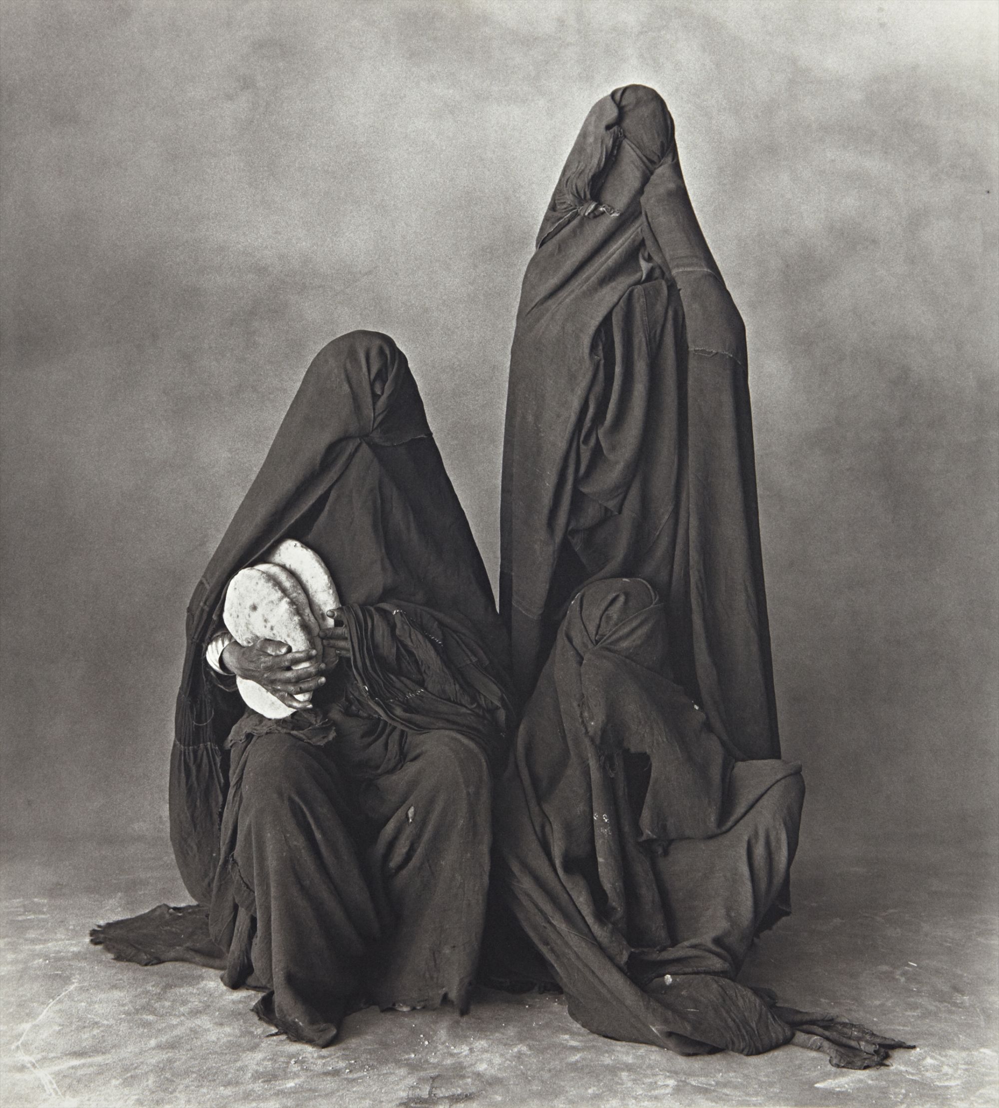 Irving Penn — Three Rissani Women with Bread (Morocco)