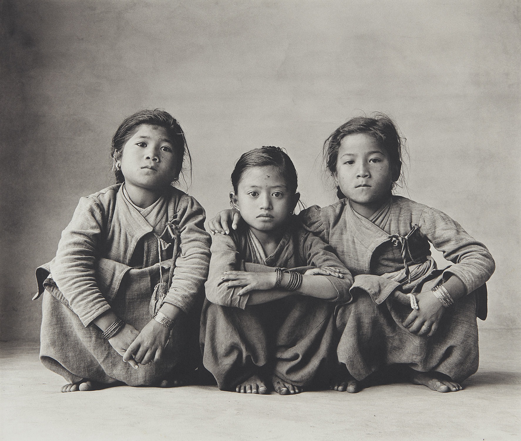 Irving Penn — Three Squatting Sisters, Nepal, 1967