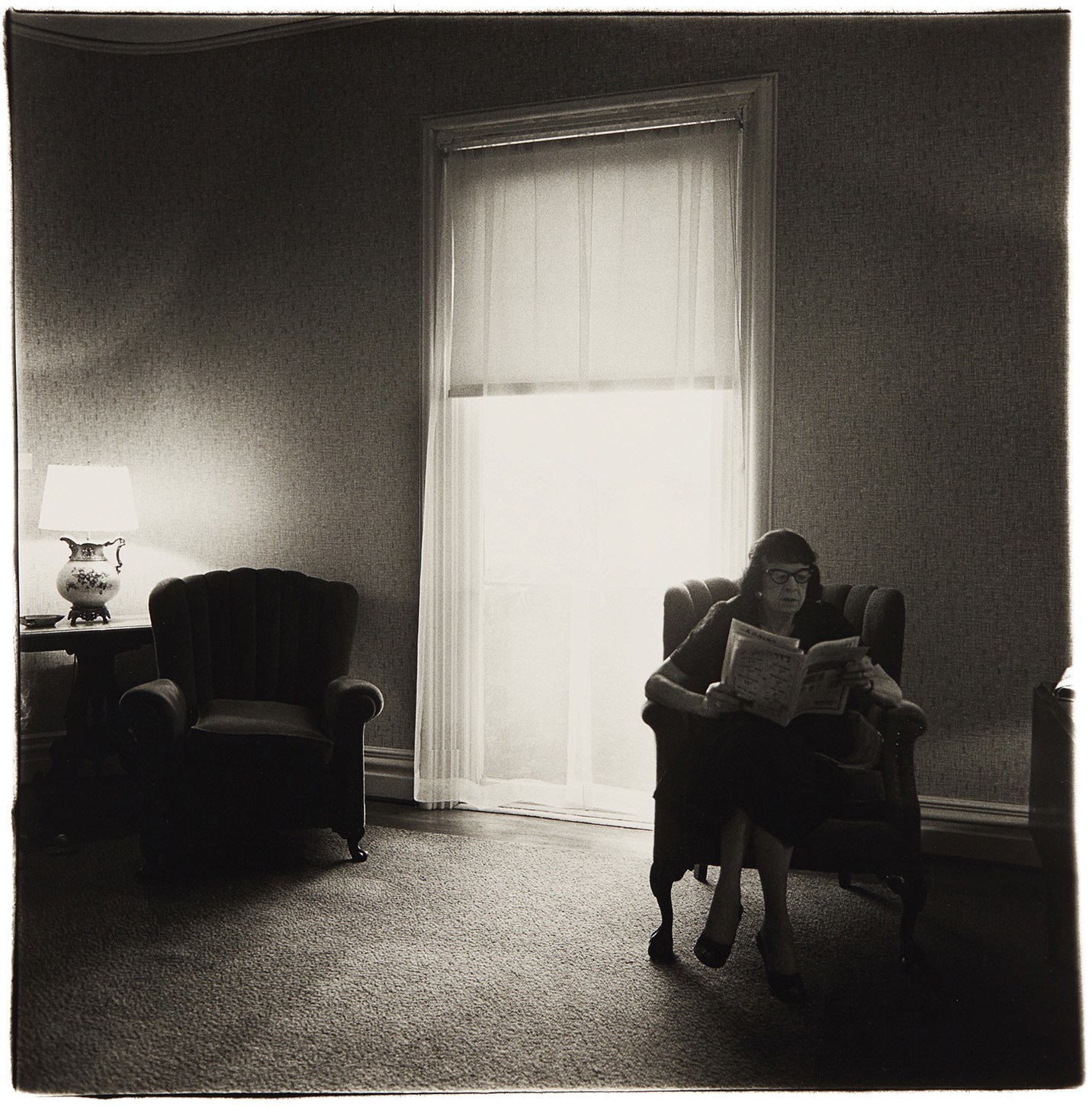 Diane Arbus — Lady in a rooming house parlor, Albion, NY