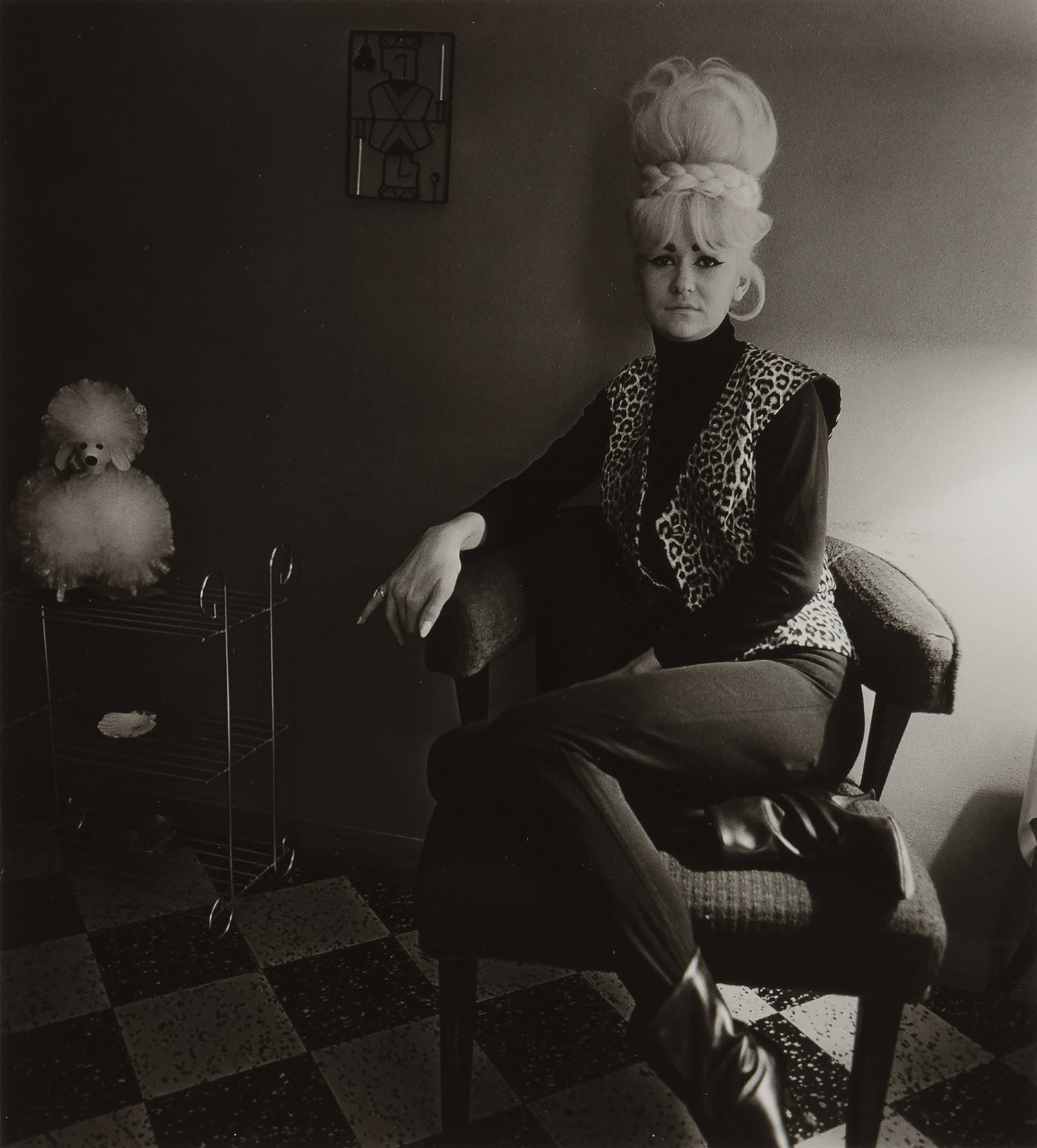 Diane Arbus — Lady Bartender At Home With Souvenir Dog, New Orleans, LA