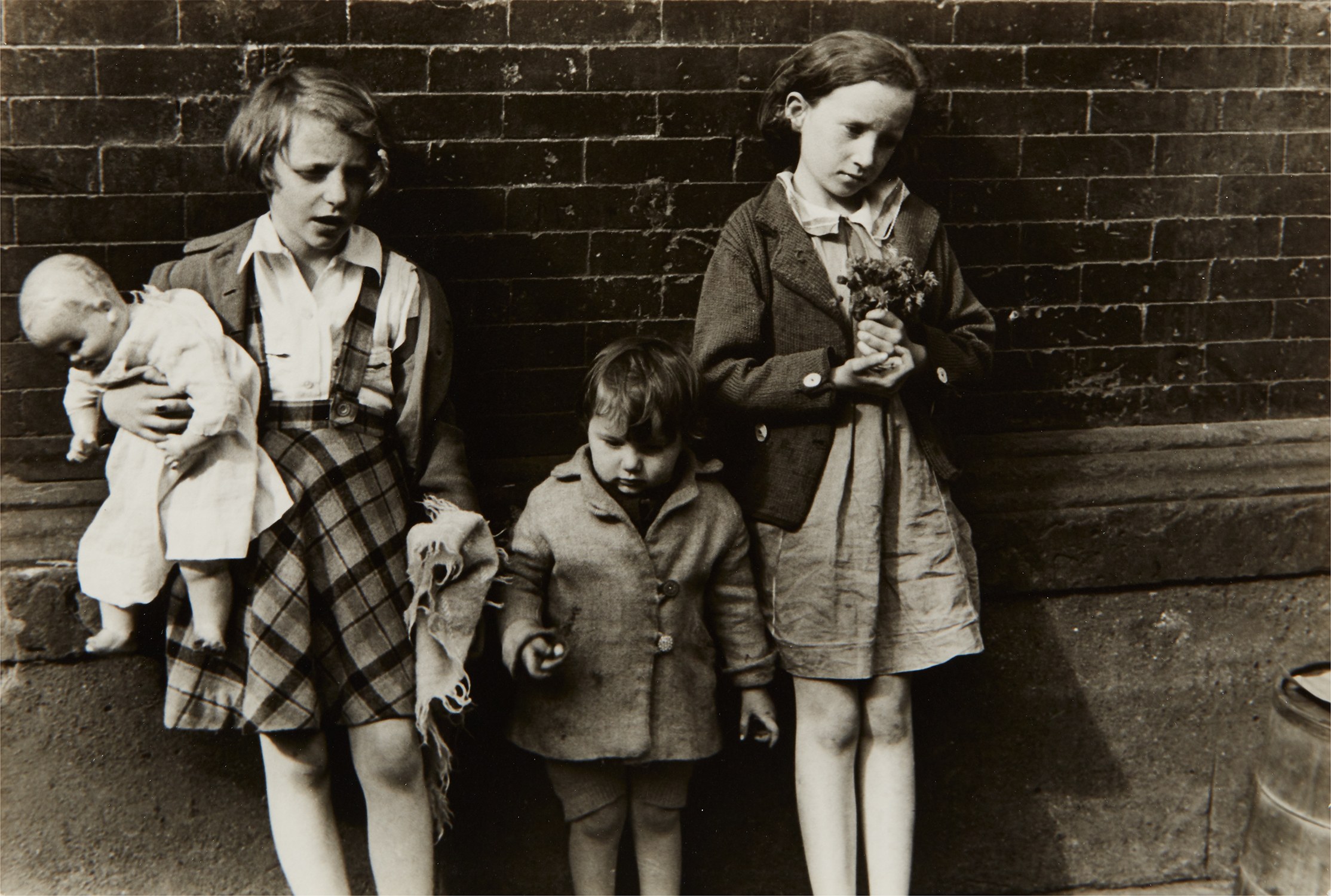 Helen Levitt — N.Y. (children with doll and flowers)