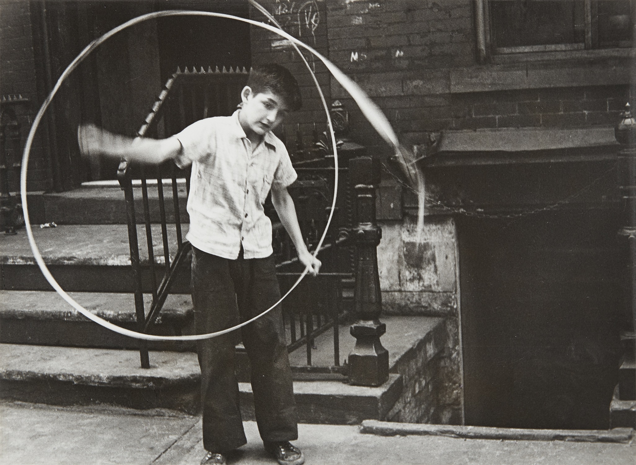 Helen Levitt — N.Y. (boy spinning ribbon)