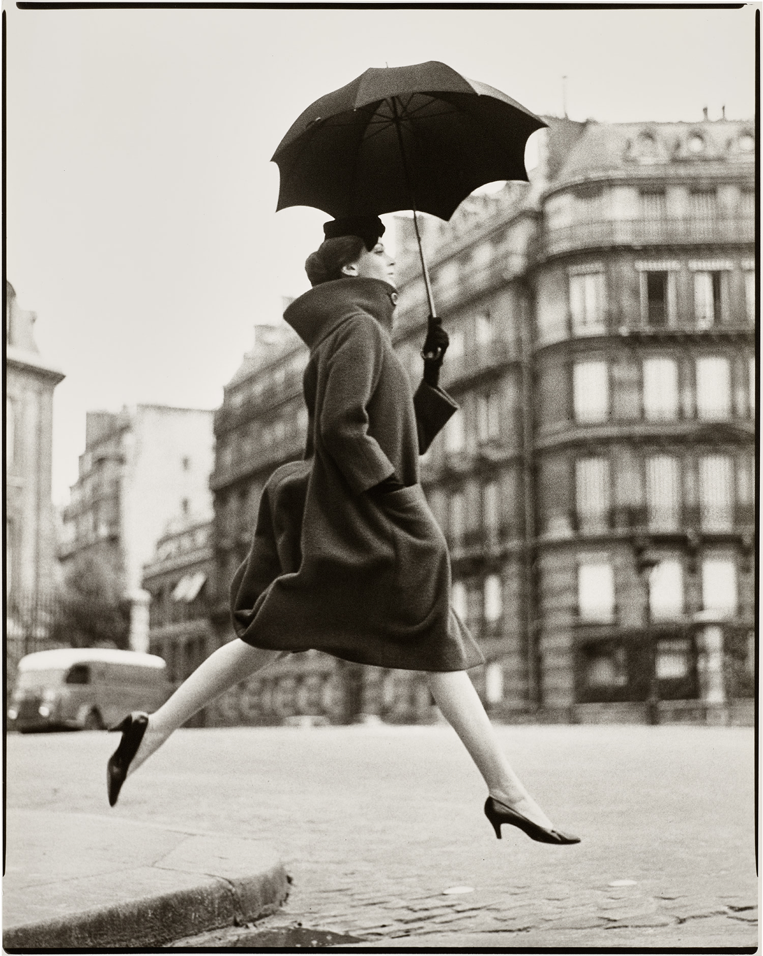 Richard Avedon — Carmen, Homage to Munkácsi, Coat by Cardin, Place François-Premier, Paris, August, 1957