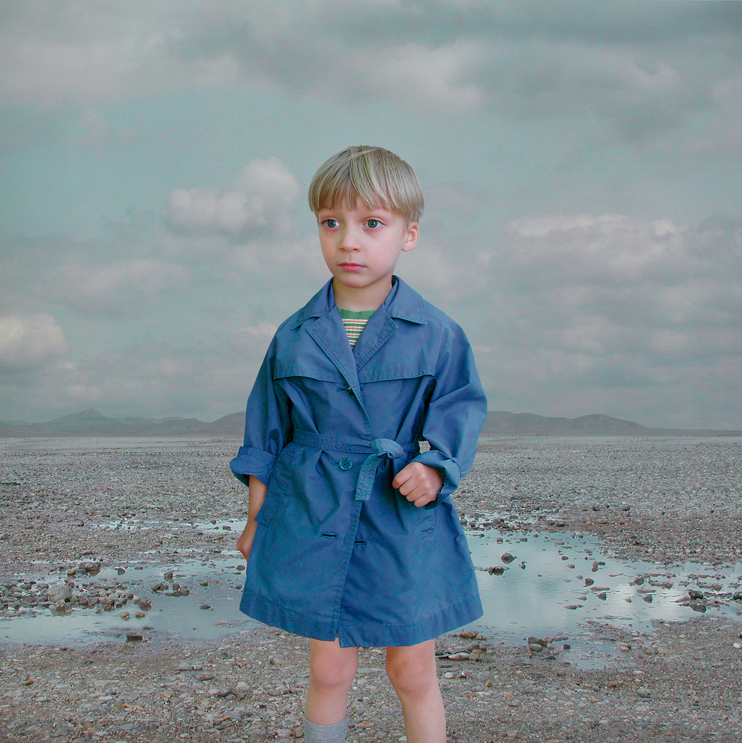Loretta Lux — Boy in a Blue Raincoat 2