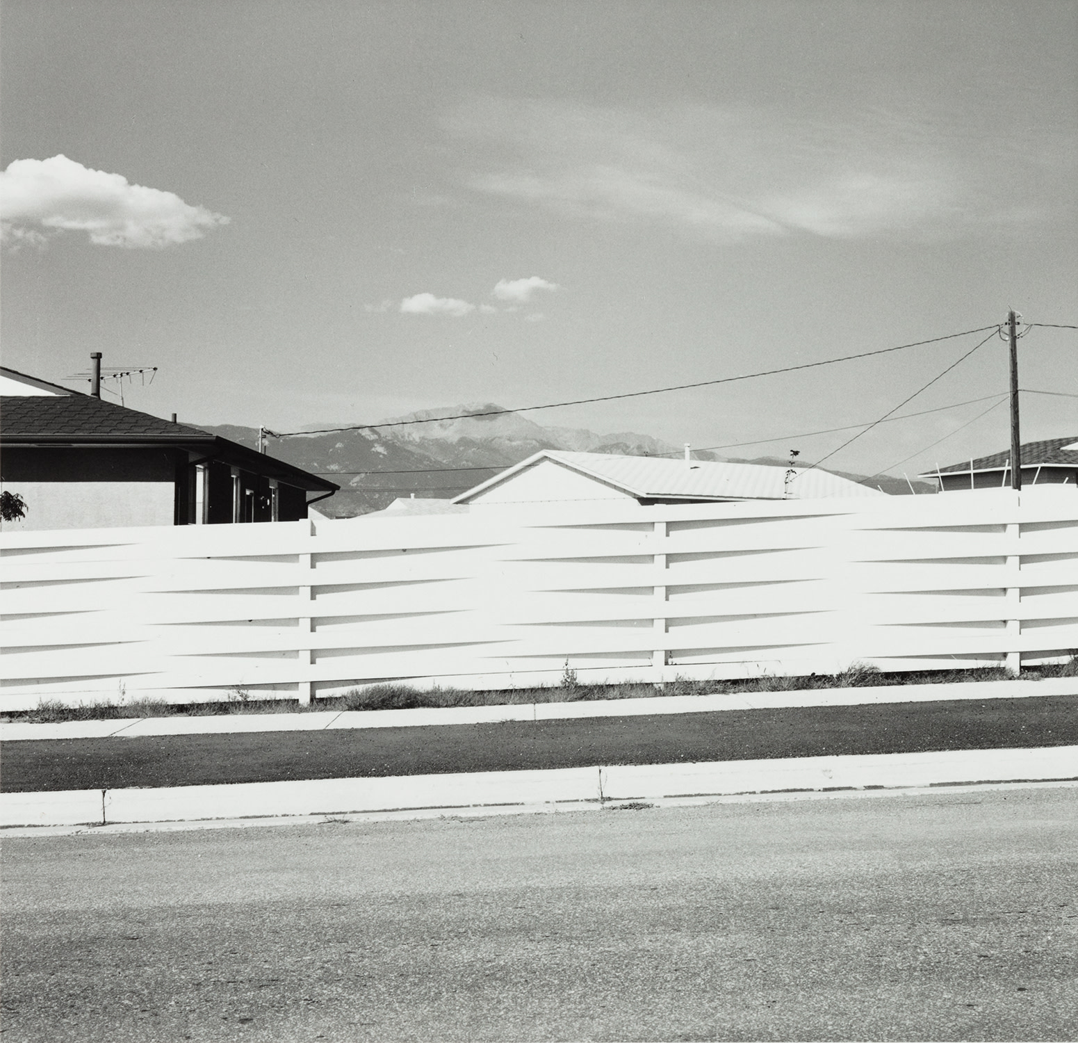 Robert Adams — Over back yard fences (Views Of Pike's Peak), Colo. Spgs.