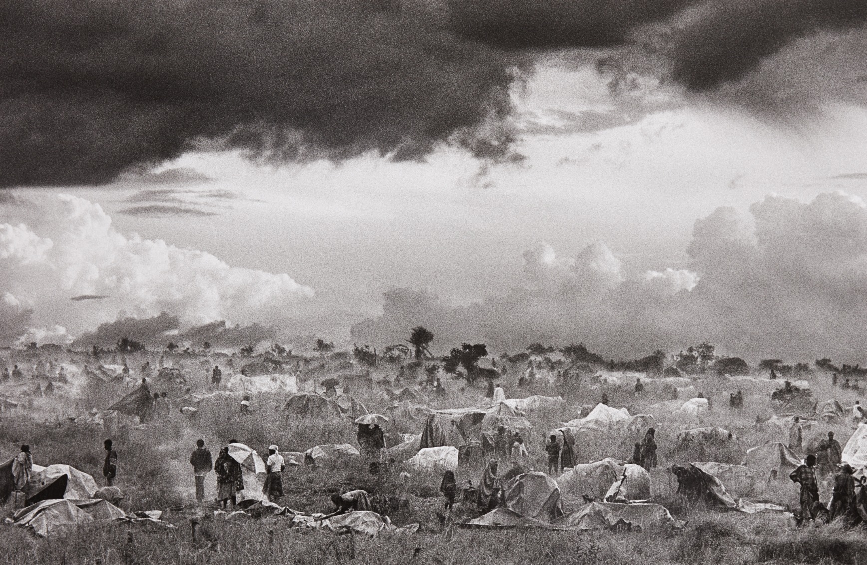 Sebastião Salgado — The first day of installation of the camp of Benako for the Rwandan Tutsi and Hutu refugees, Tanzania