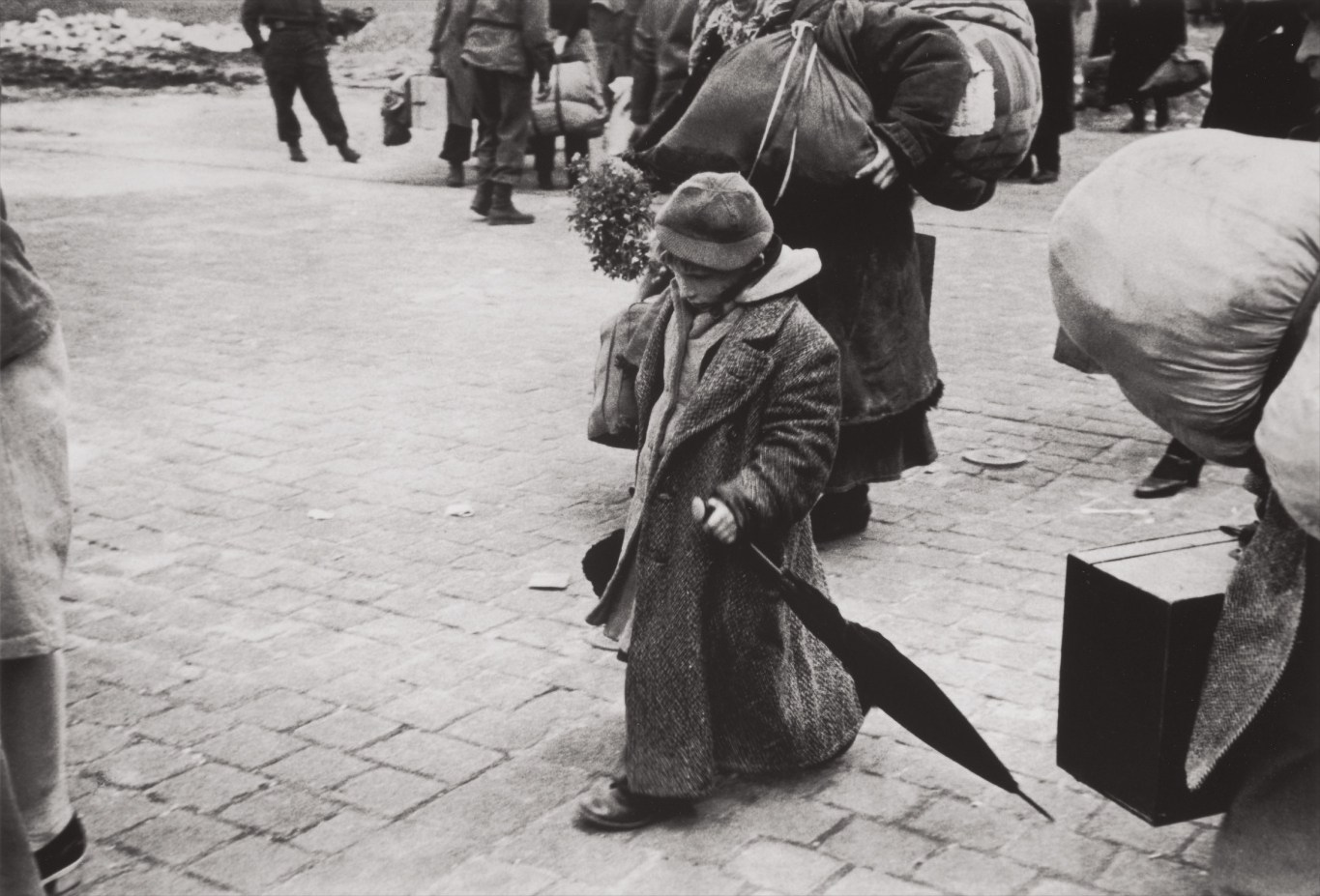 Henri Cartier-Bresson — A Soviet child who was deported with his parents, returning to his homeland, Transit Camp, Dessau, Germany