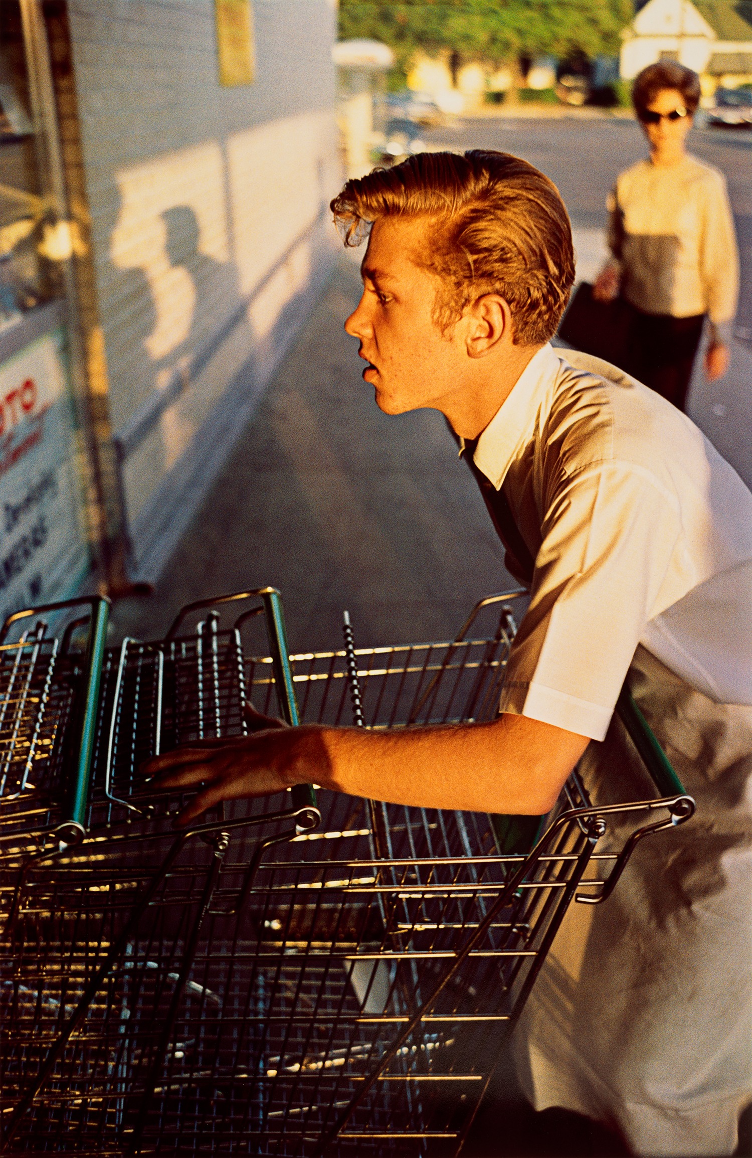 William Eggleston — Memphis (supermarket boy with carts)