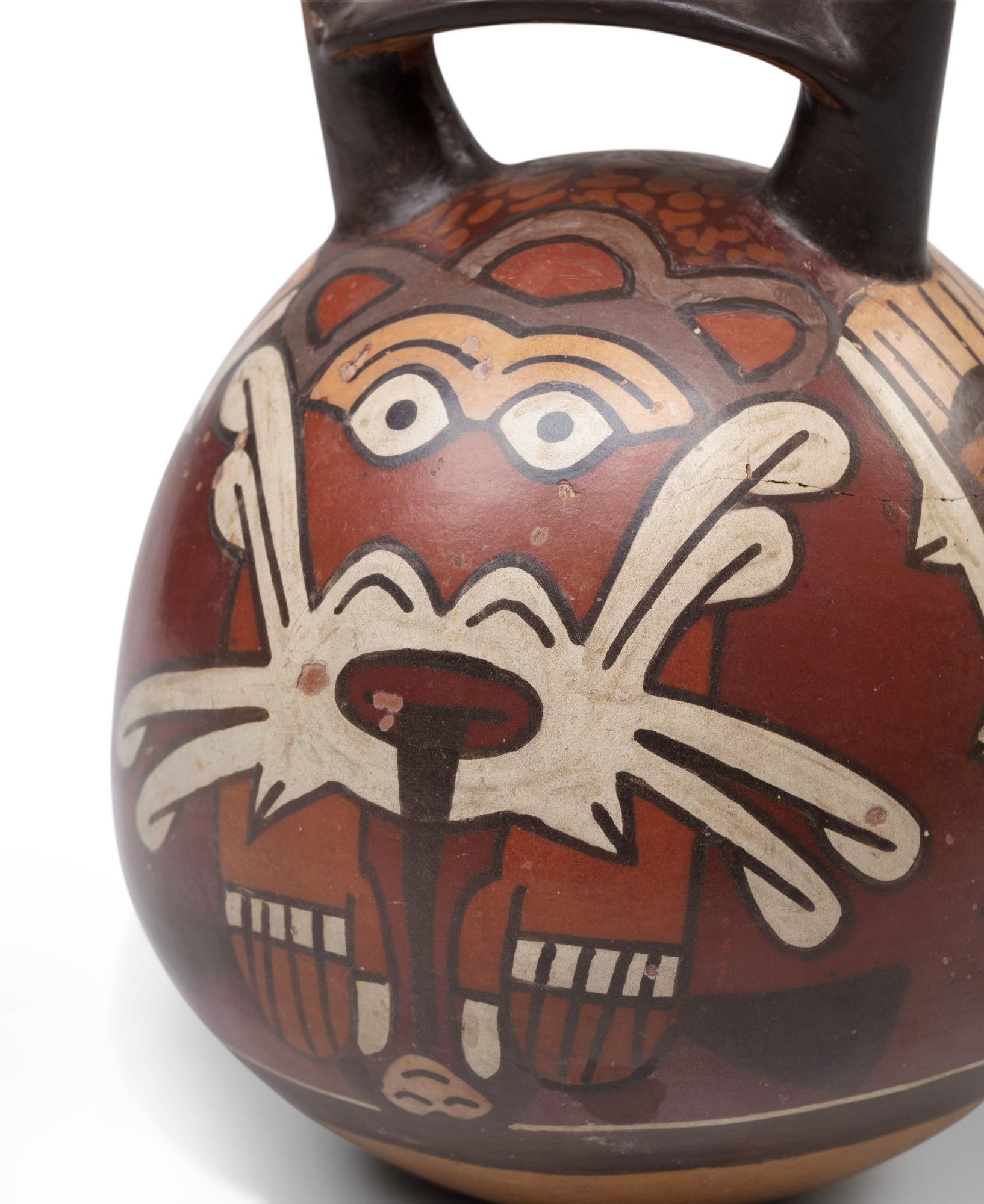 Vase double gourde polychrome à décors d'une divinité masquée, Nazca, Pérou, 300-600 Ap. J.-C. — Nasca polychrome bridge-spout vessel with masked deity face, Peru, AD 300-600