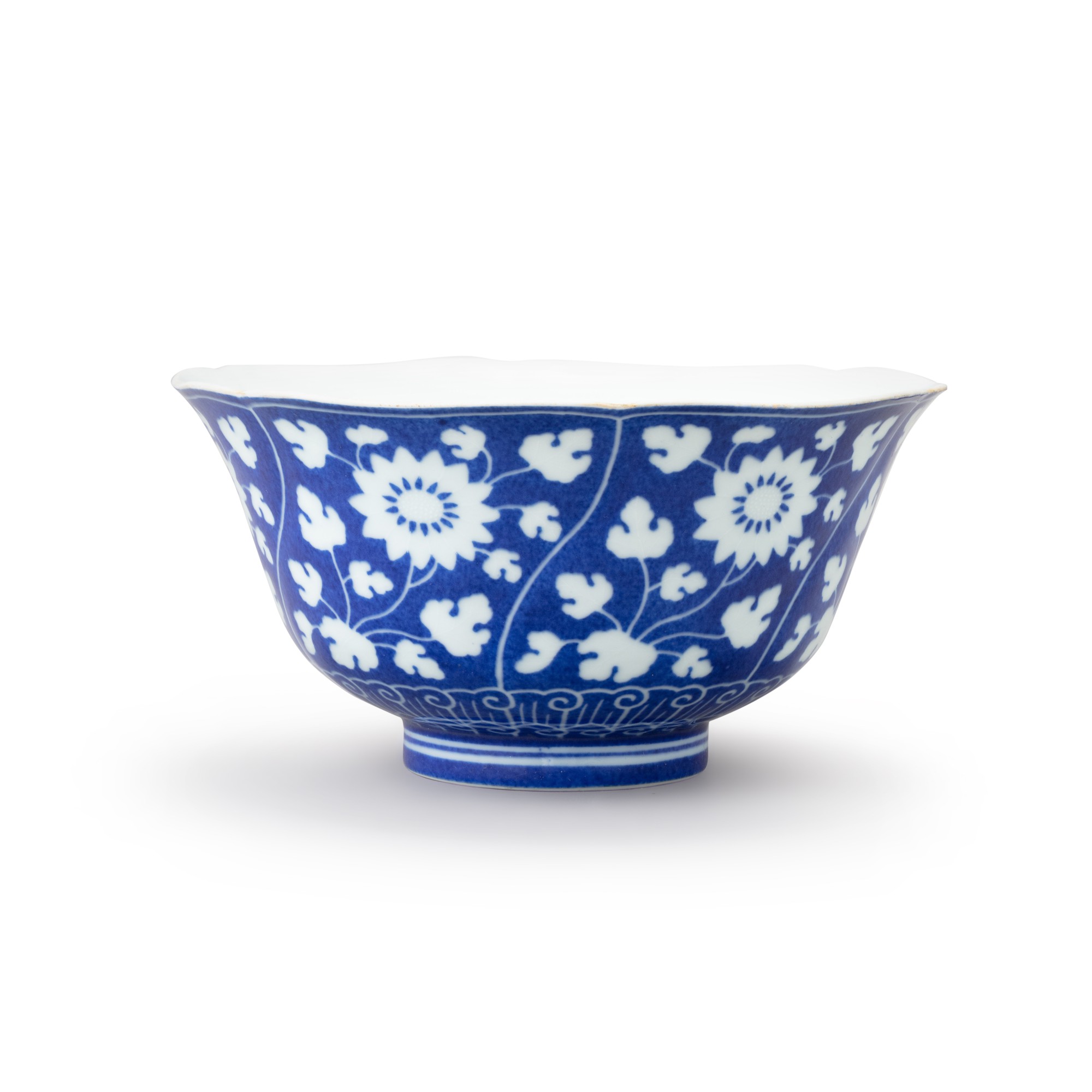 A reversed-decorated blue and white ‘chrysanthemum' bowl — 清雍正 灑藍地留白菊花紋盌  《大清雍正年製》款