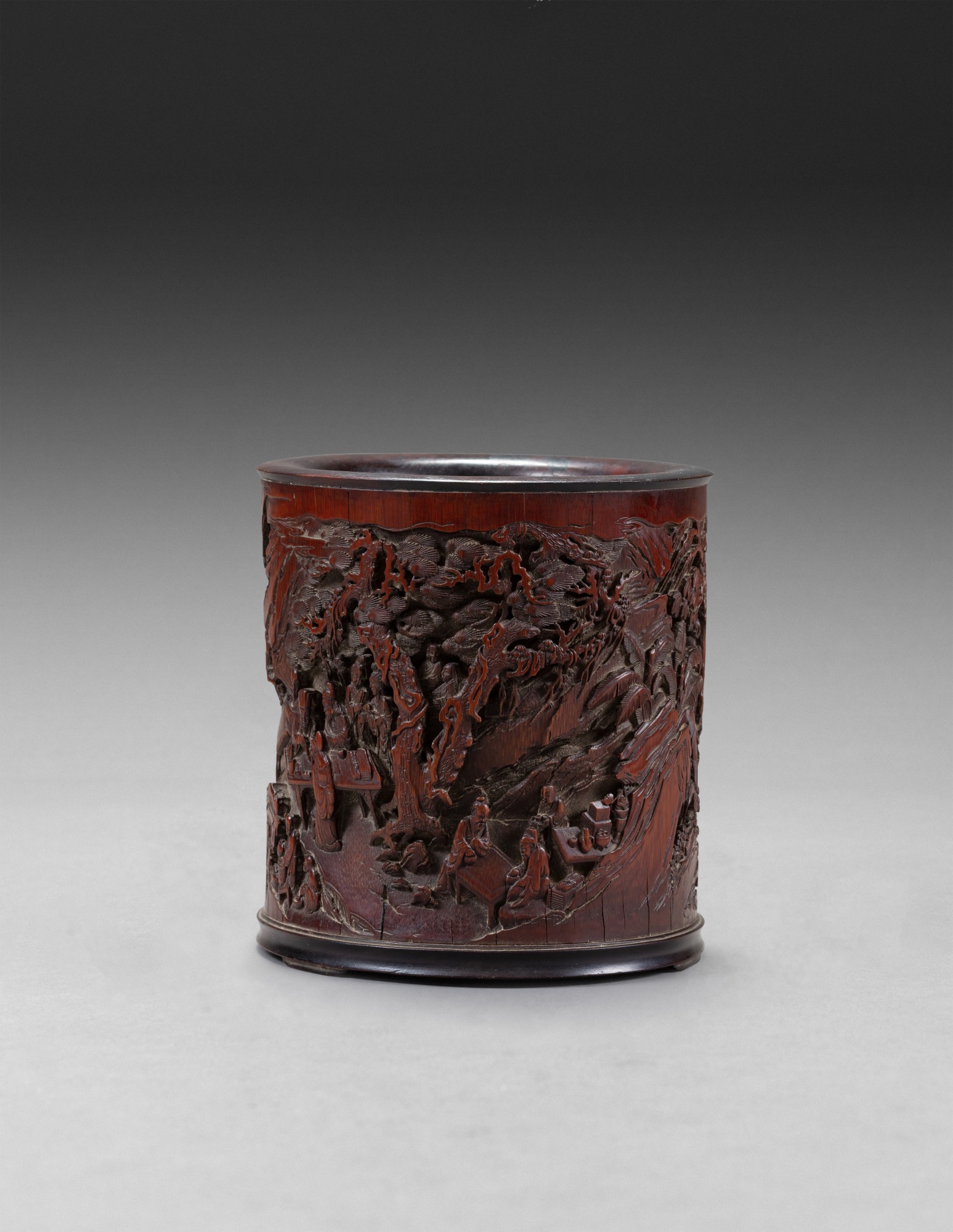 A carved bamboo ‘literati’ brush pot — 清十九世紀 竹雕文人雅集圖筆筒