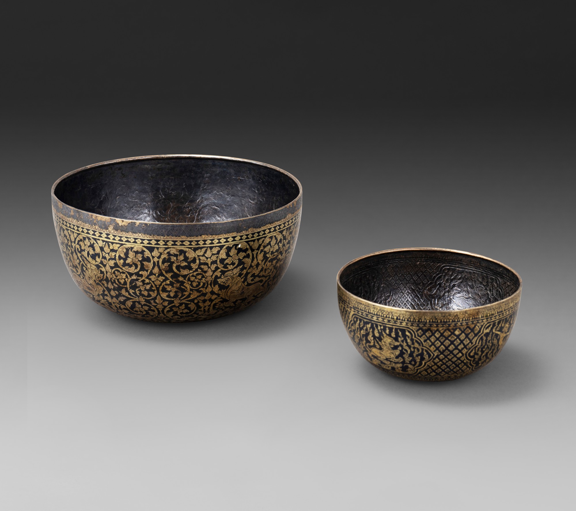 Two rare gold niello-inlaid silver bowls — 暹邏十九世紀 鎏金銀錯黑金花卉紋砵兩件