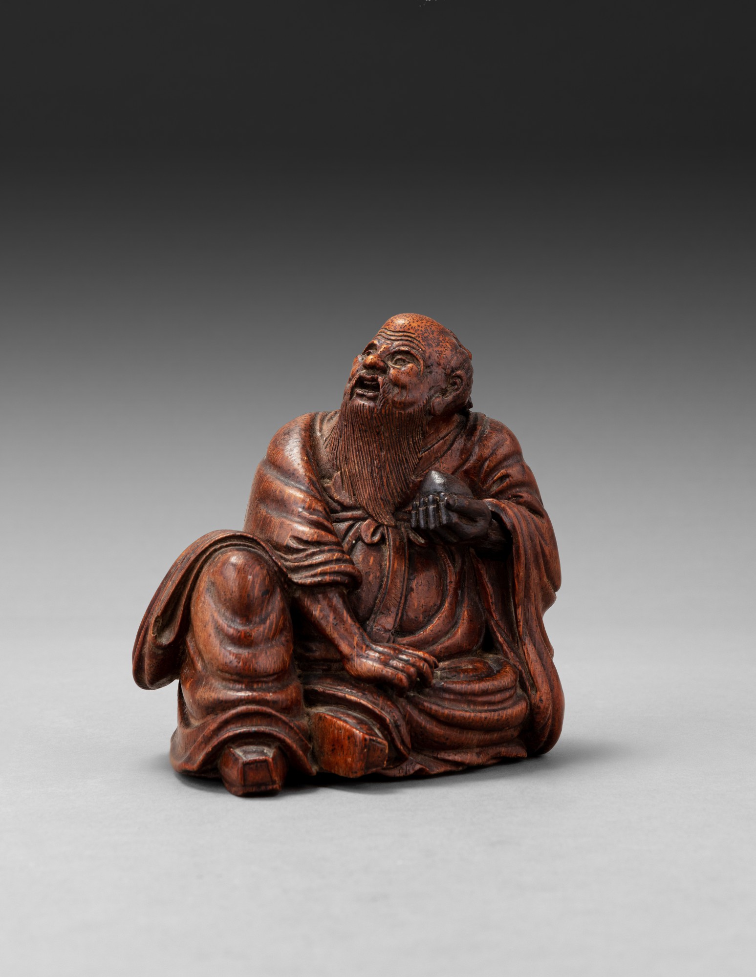 A carved bamboo figure of Shoulao — 清十九世紀 竹雕壽老坐像